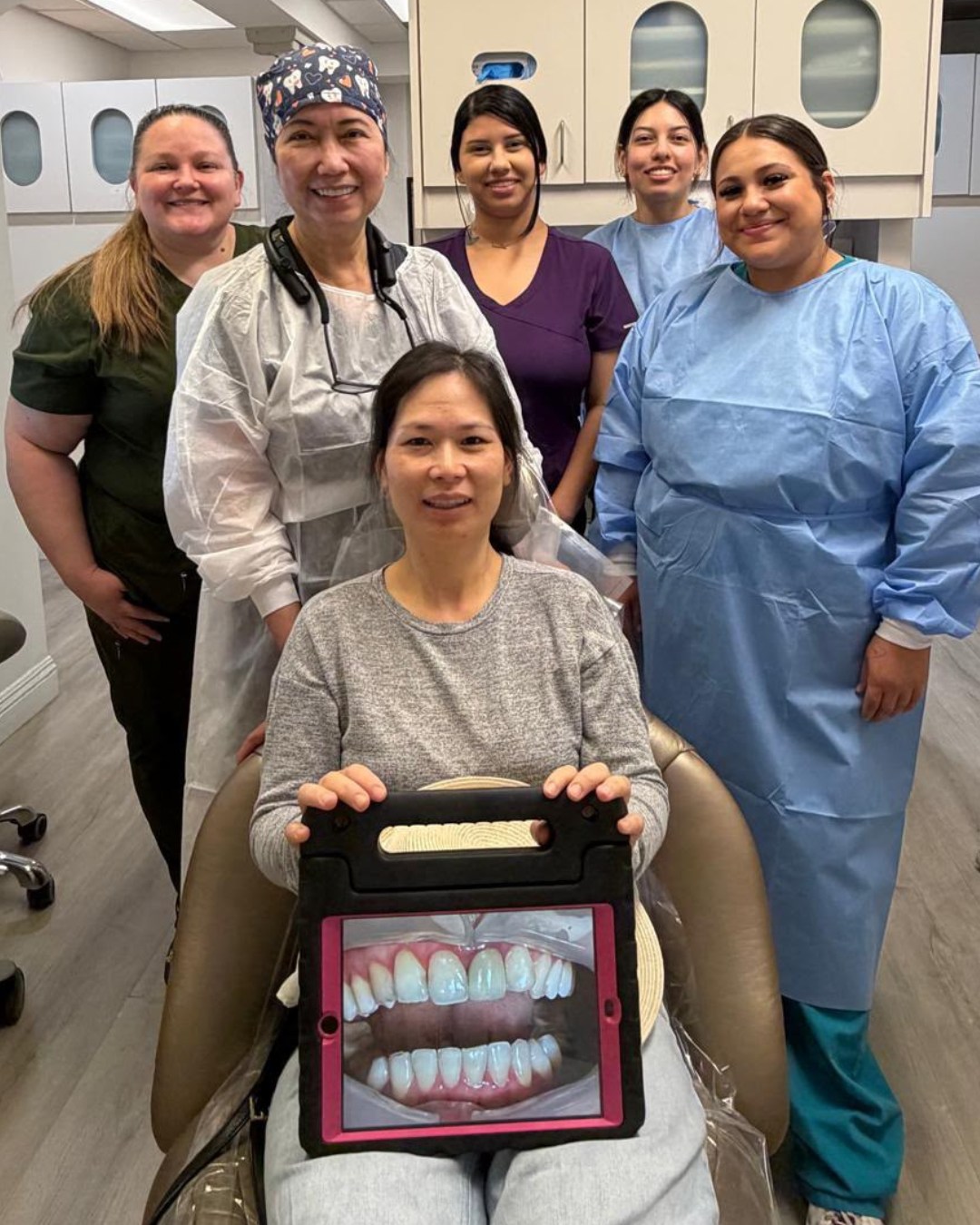 Altavas Dental Invisalign patient holding their before photo