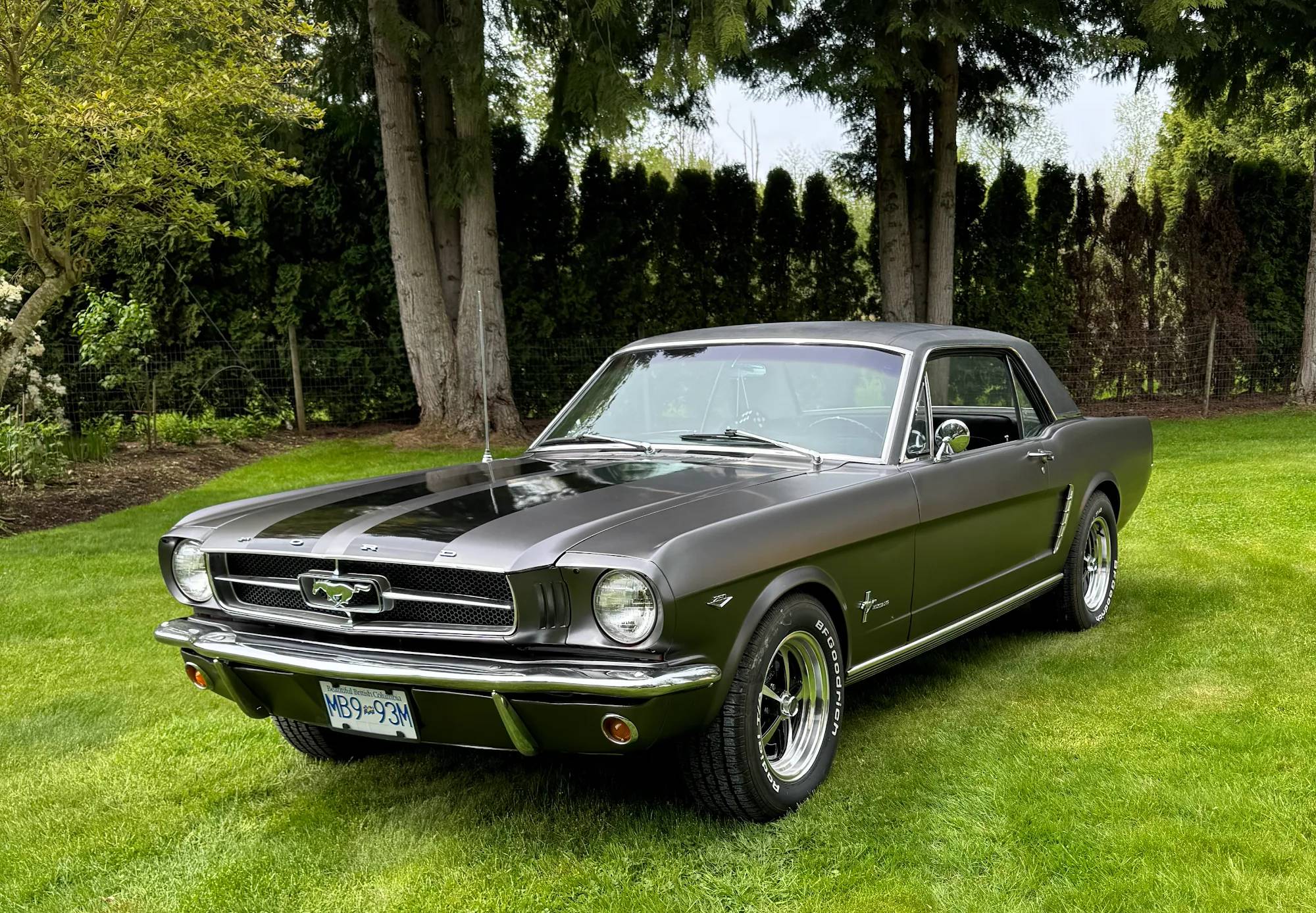 Classic Ford Mustang coupe in a satin dark charcoal full color change wrap with black racing stripes, wrapped by Prestige Auto Wrapping in Mission, BC