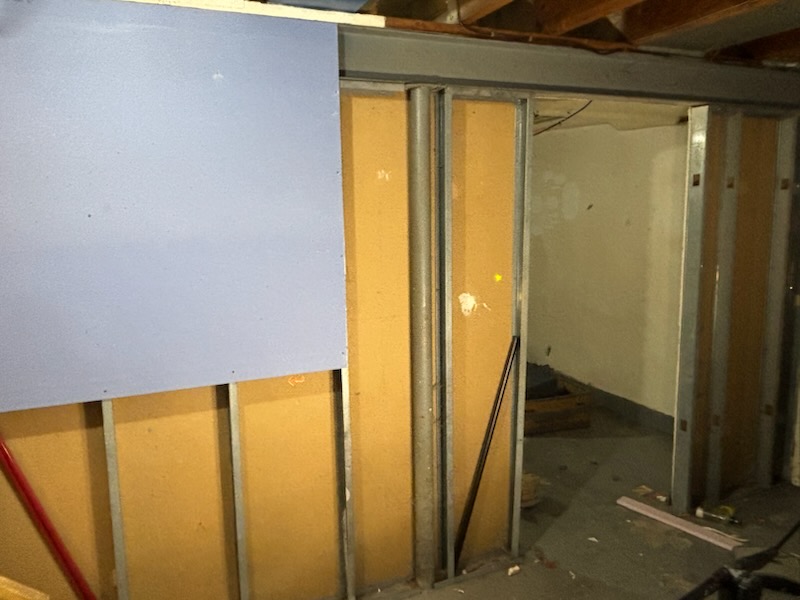Rental room before turnover in Youngstown OH — damaged walls