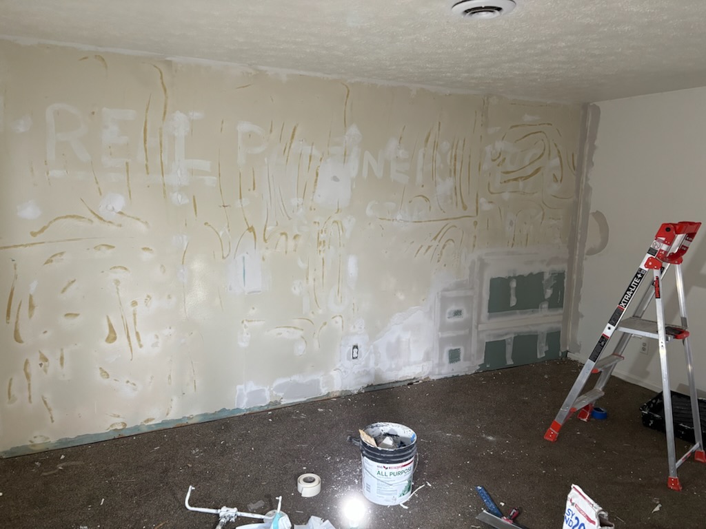 Damaged drywall wall before repair by New Page Reno LLC in Youngstown OH