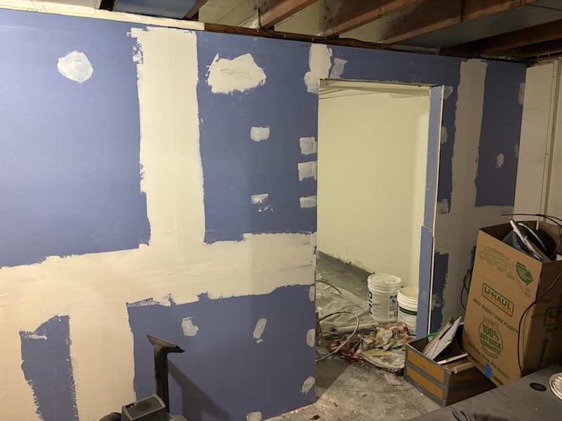 Rental room during drywall repair and prep by New Page Reno