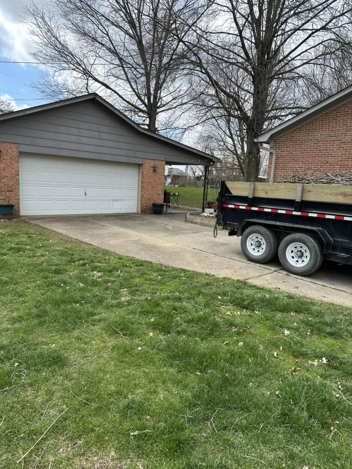 Colvin's Cleanup crew on site with a loaded hauling trailer in Coxs Creek, KY.
