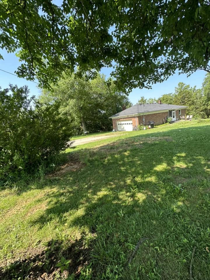 Full home cleanout — old furniture and appliances removed from a Kentucky house.