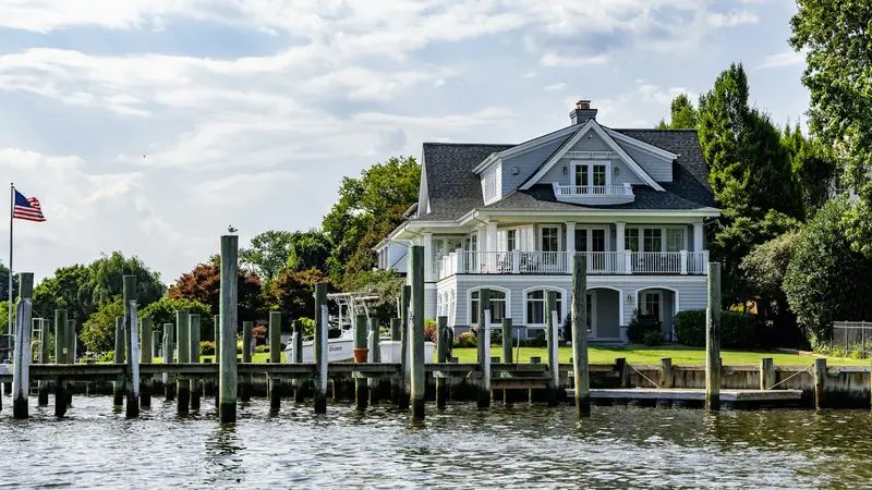 Waterfront home with a private dock and pilings
