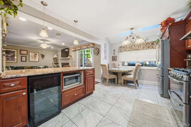 Kitchen with granite counters and a wine refrigerator