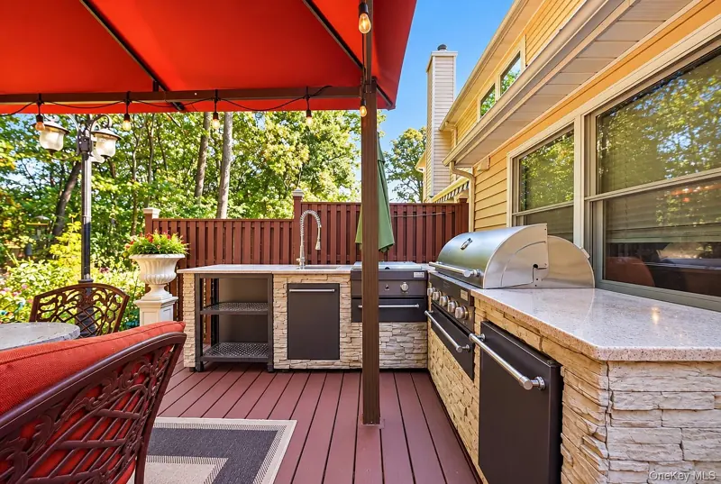 Outdoor kitchen with a built-in BBQ
