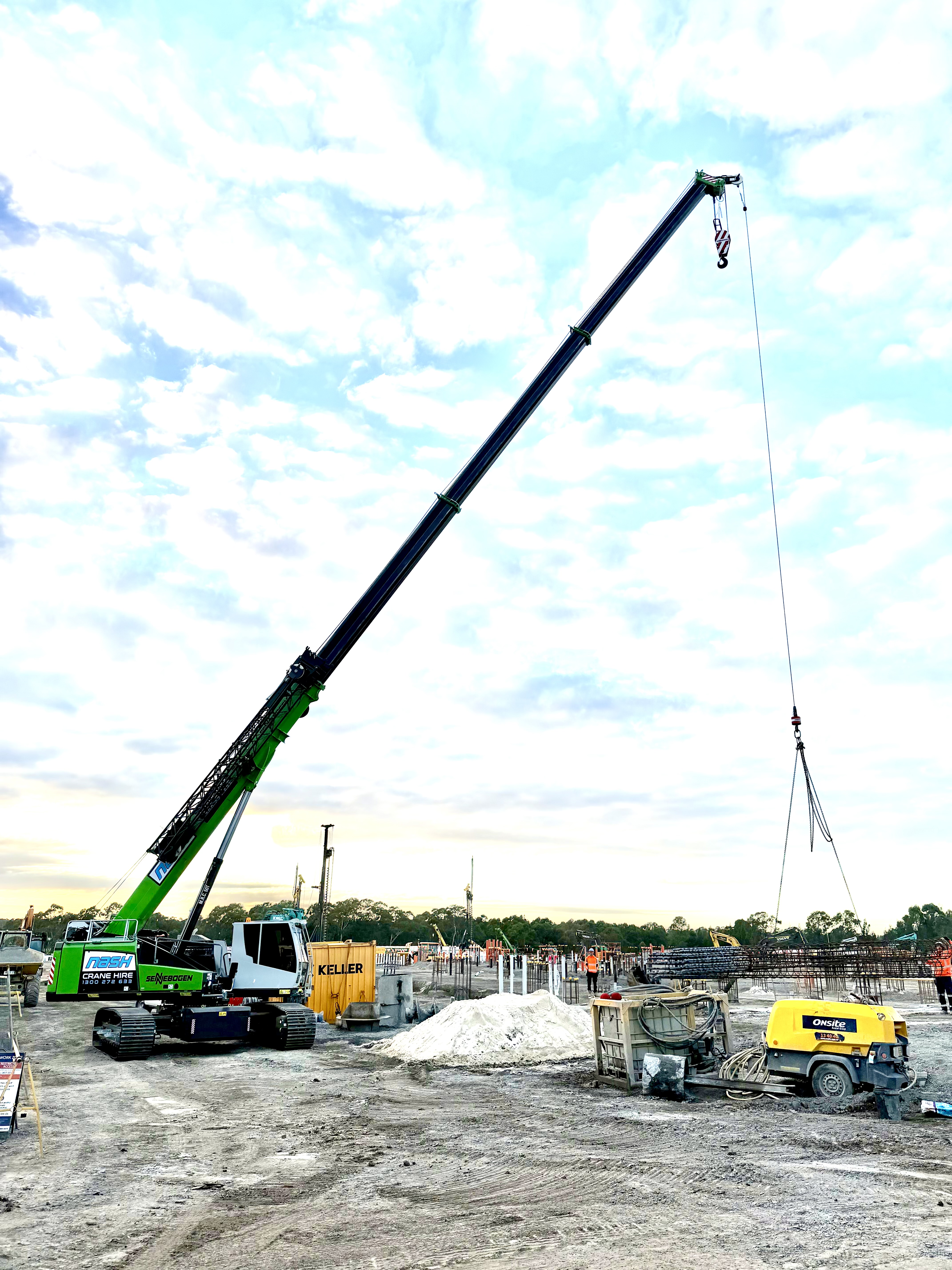Nash mini crane operating in a tight-access urban site between buildings