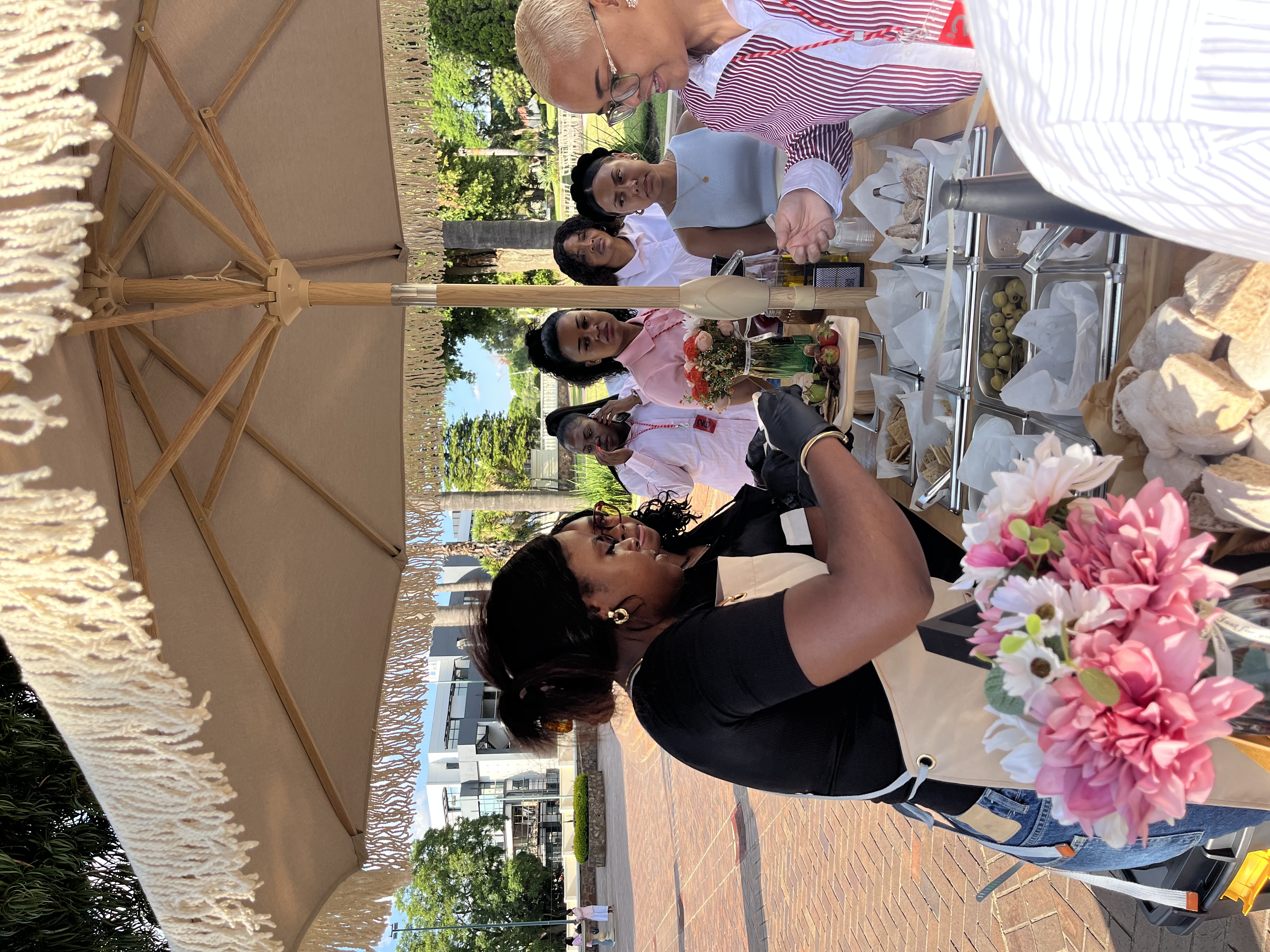 Modern Johannesburg corporate event with diverse professionals around the Nibble & Nest cart