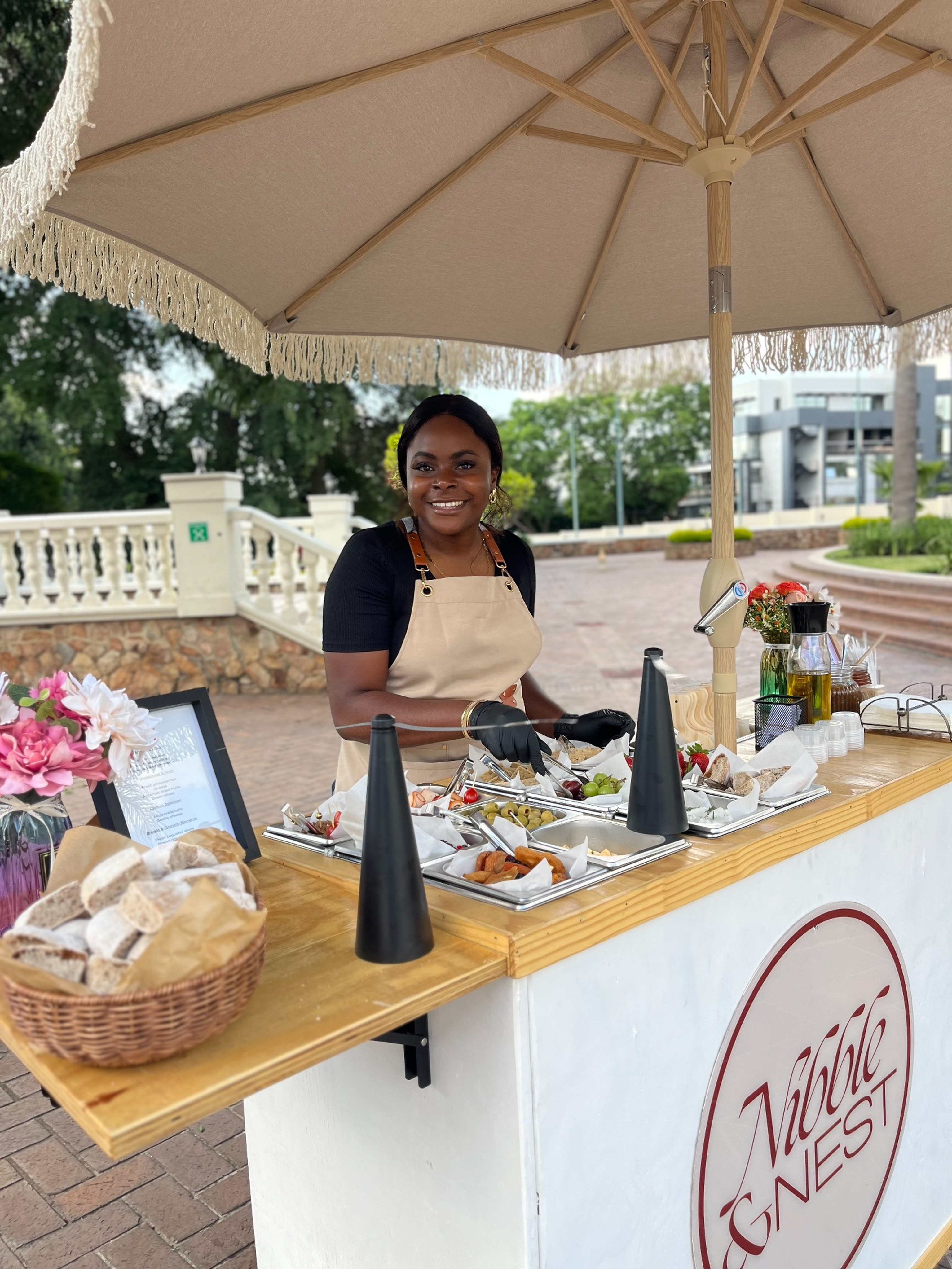 Nibble & Nest operator preparing fresh mini pancakes live at an event