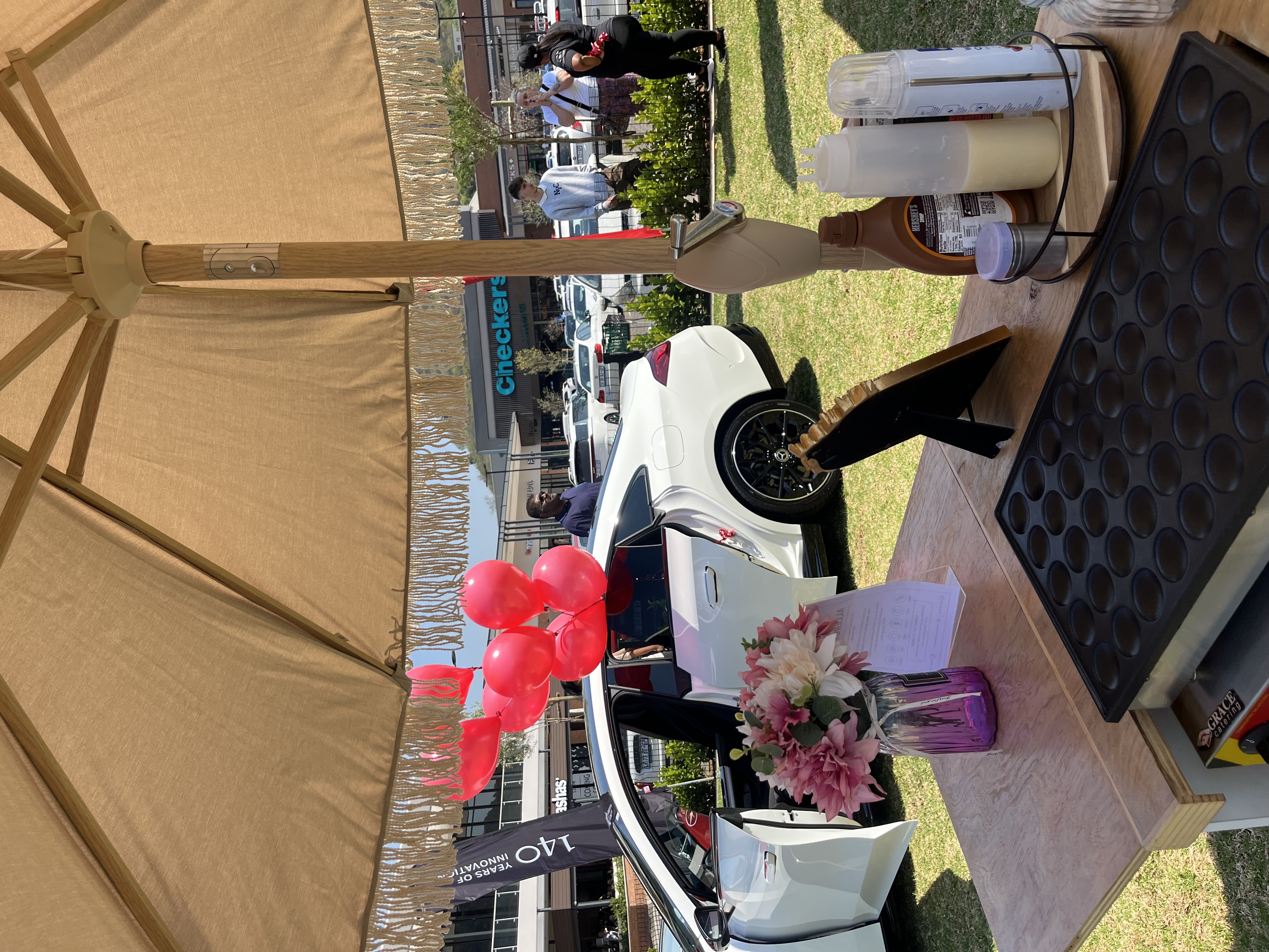 Celebration setup with cart and balloons