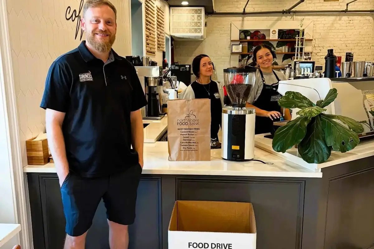 Sirincci Coffee Company team behind the counter during a community food drive