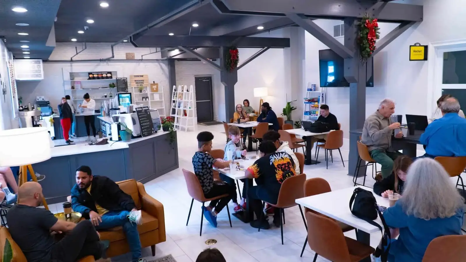 Customers sitting and working inside Sirincci Coffee Company