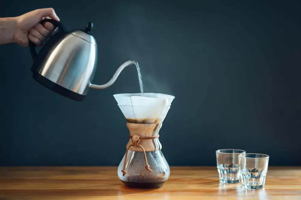 Pour-over coffee being brewed in a glass carafe