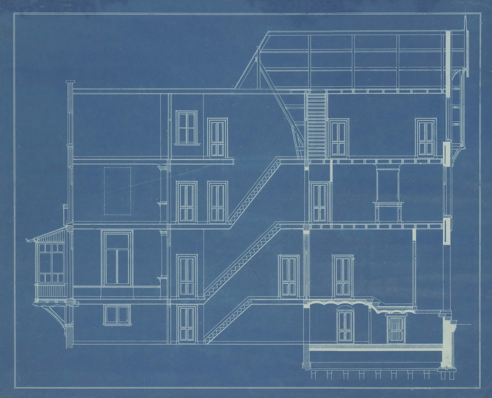A blue architectural blueprint showing a cross-section of a multi-storey building, representing the blueprint a business needs before it can be scaled or sold