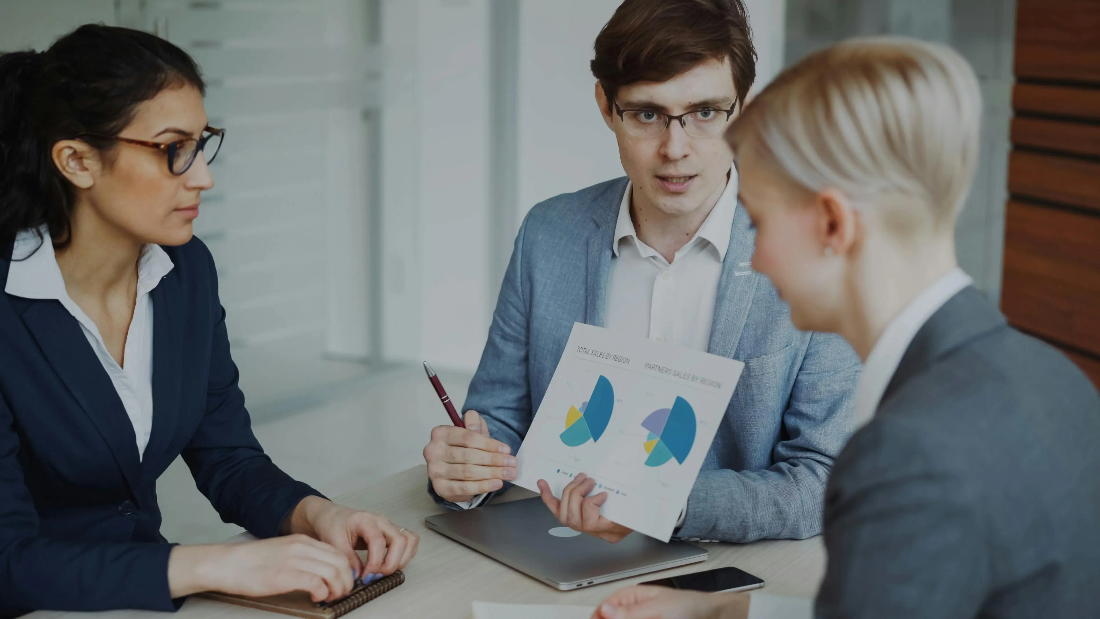 Business team collaborating on revenue strategy and AI implementation planning