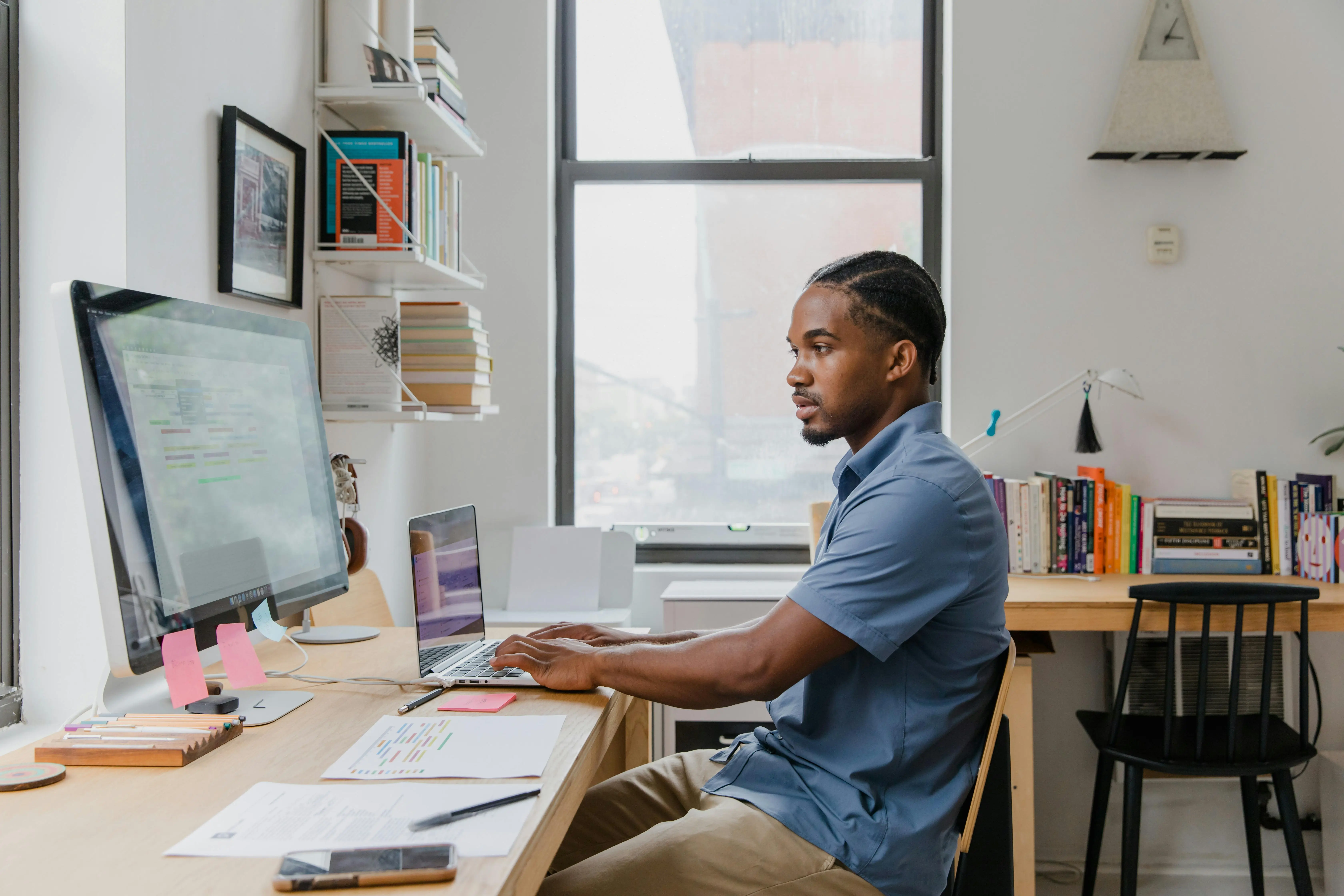 SMB business owner in a modern office reviewing a holographic dashboard showing AI agent workflow icons for customer support, scheduling, invoicing, and outreach, all connected