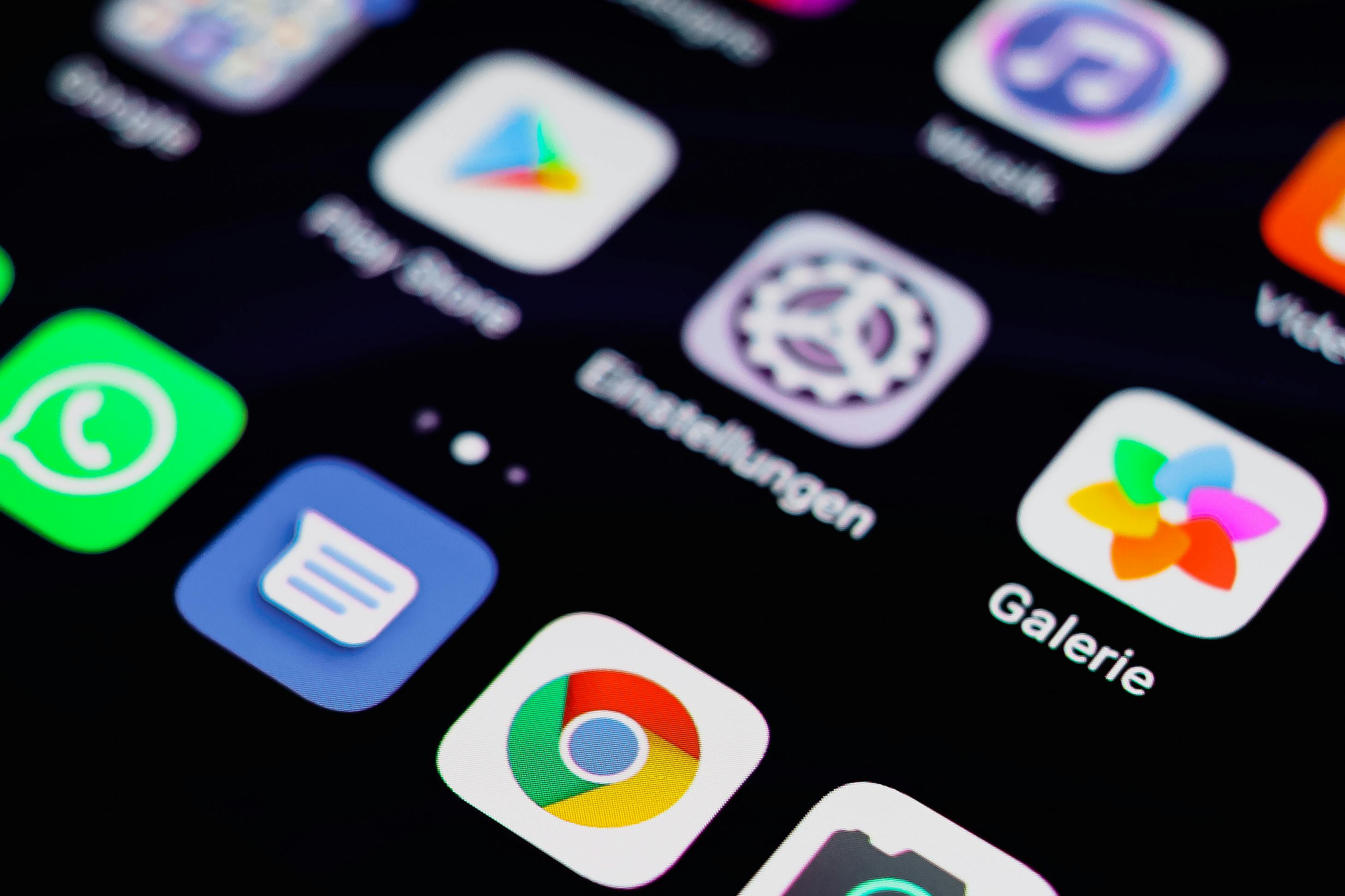 A business professional looking overwhelmed at a cluttered screen of overlapping application windows, representing the chaos of AI sprawl and over-automation in a small business