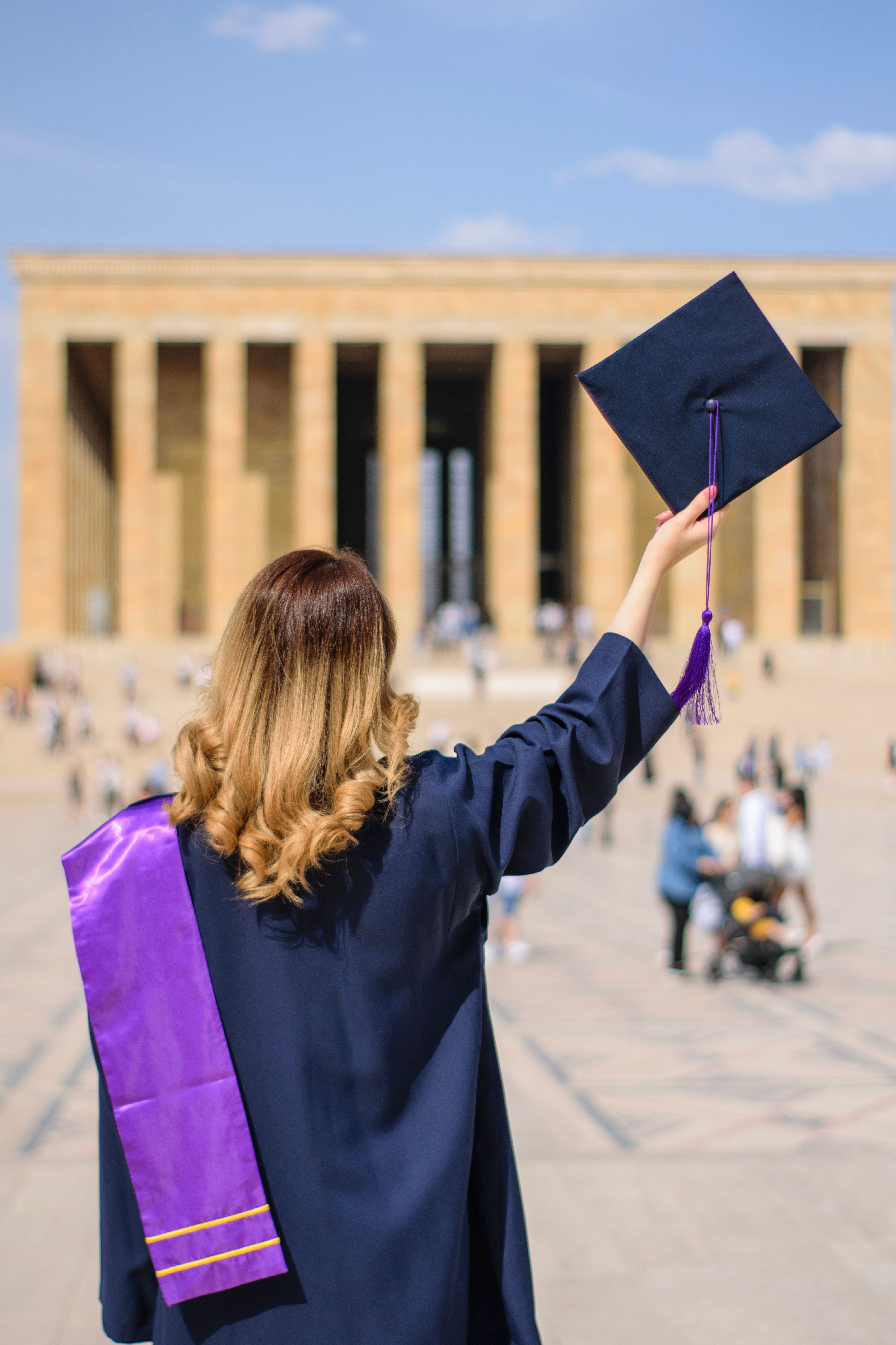 Indian student celebrating graduation in Canada — post-graduation work permit PGWP pathway to PR