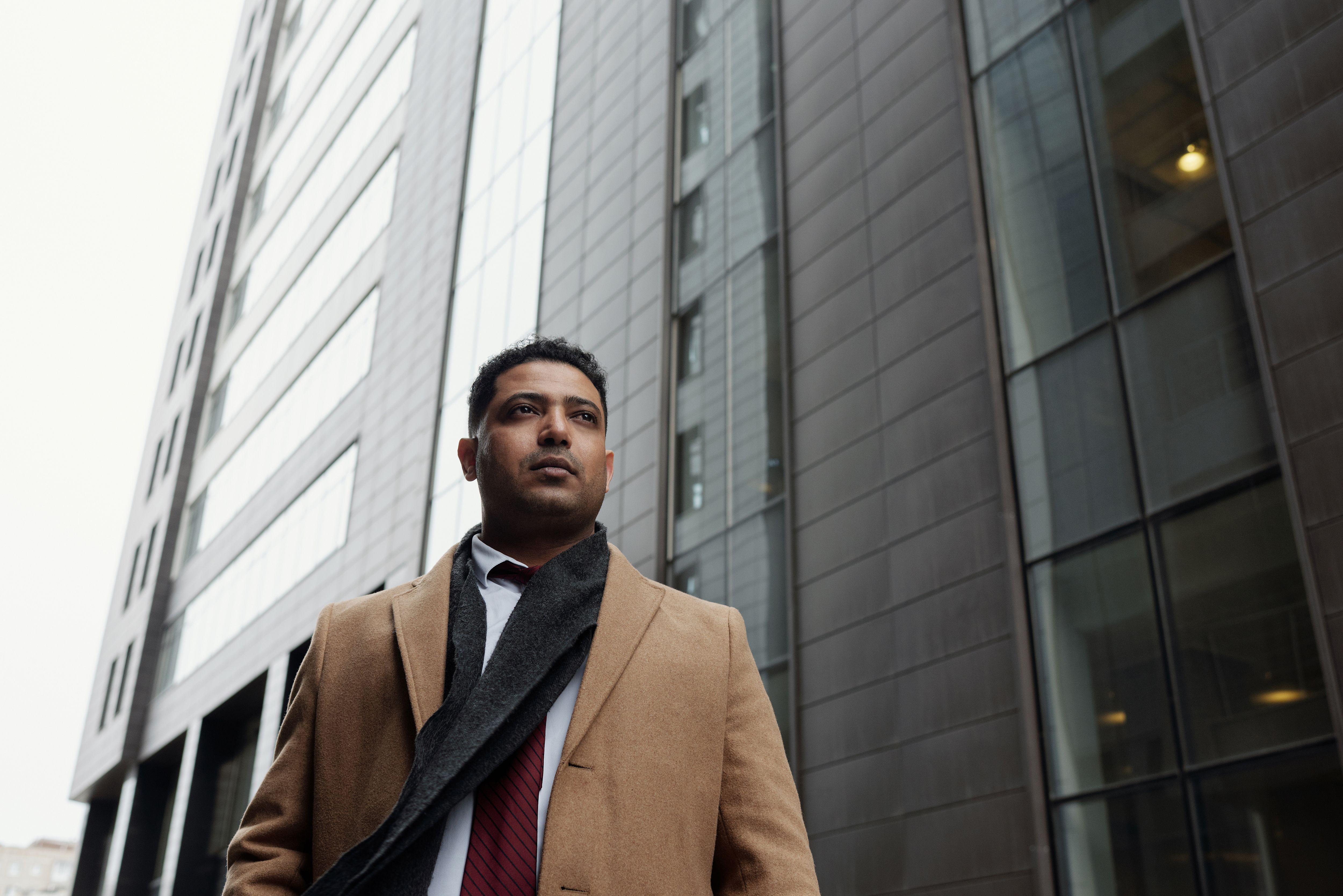Immigrant entrepreneur reviewing business documents — registering a company in Ontario Canada 2026