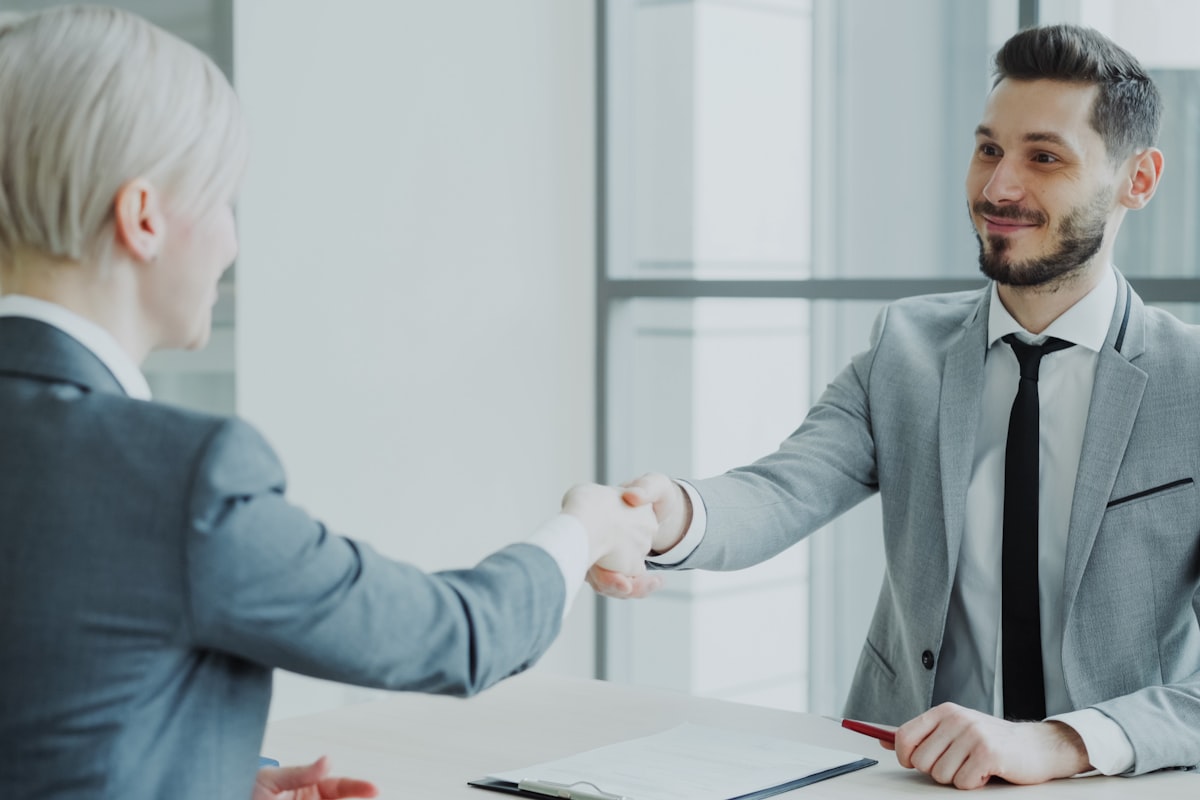 Immigrant entrepreneur in Ontario reviewing incorporation paperwork with a business advisor