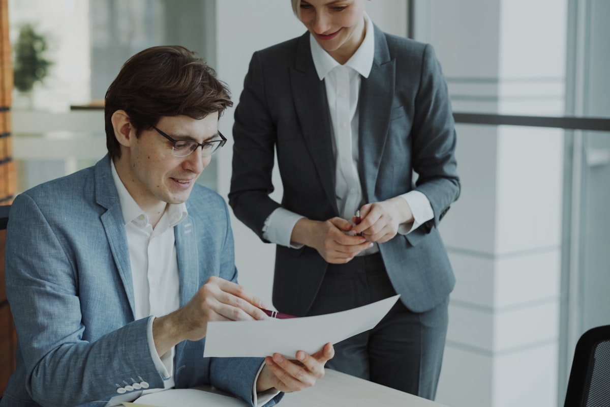 Real estate investor reviewing resale condo listing and pre-construction contract documents side by side