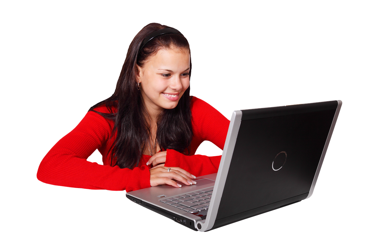 A small business owner reviewing customer engagement information on her laptop