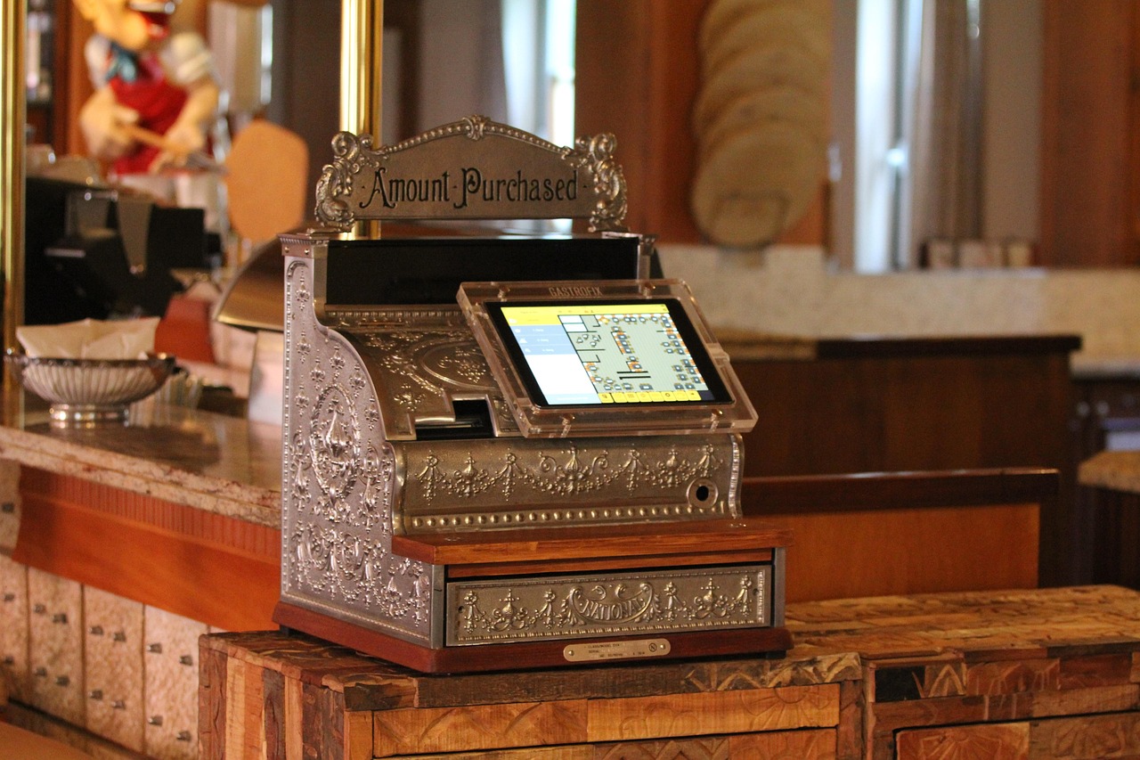 Restaurant staff using an iPad-based point-of-sale system to process an order during a busy shift