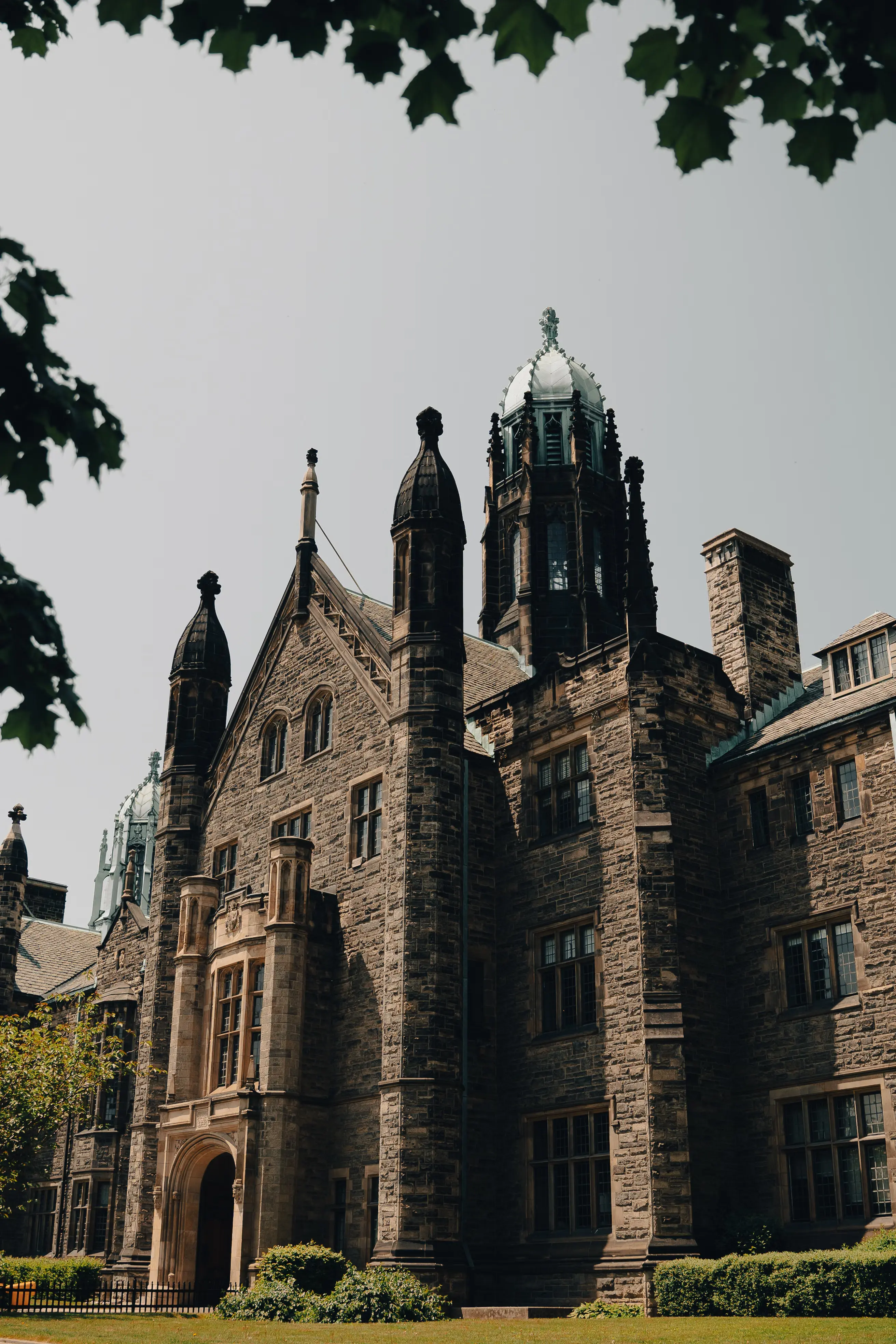 Gothic Revival stone building at Trinity College, University of Toronto, a designated learning institution in Ontario
