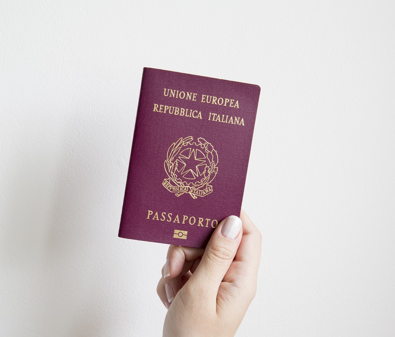 Passport and visa documents on a desk, representing the immigration paperwork under review in Canada's international student program audit