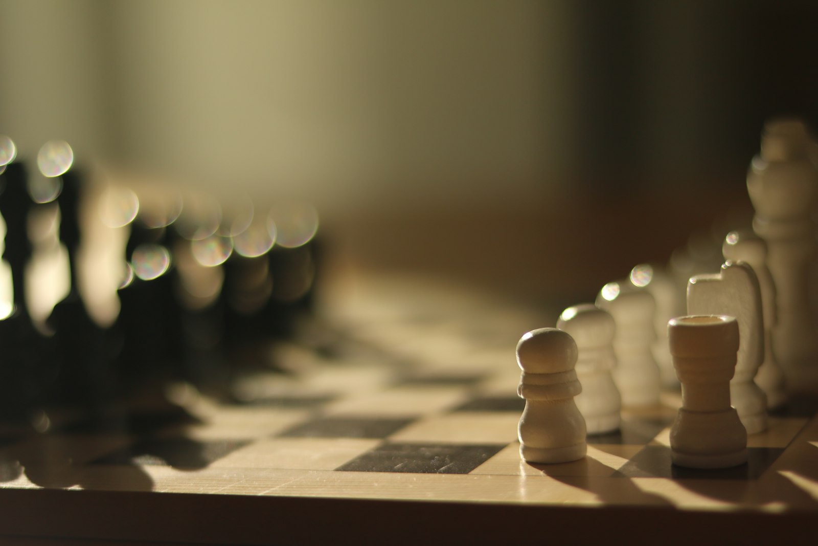Chess pieces lined up on a chessboard, representing strategic decisions that stay with the founder