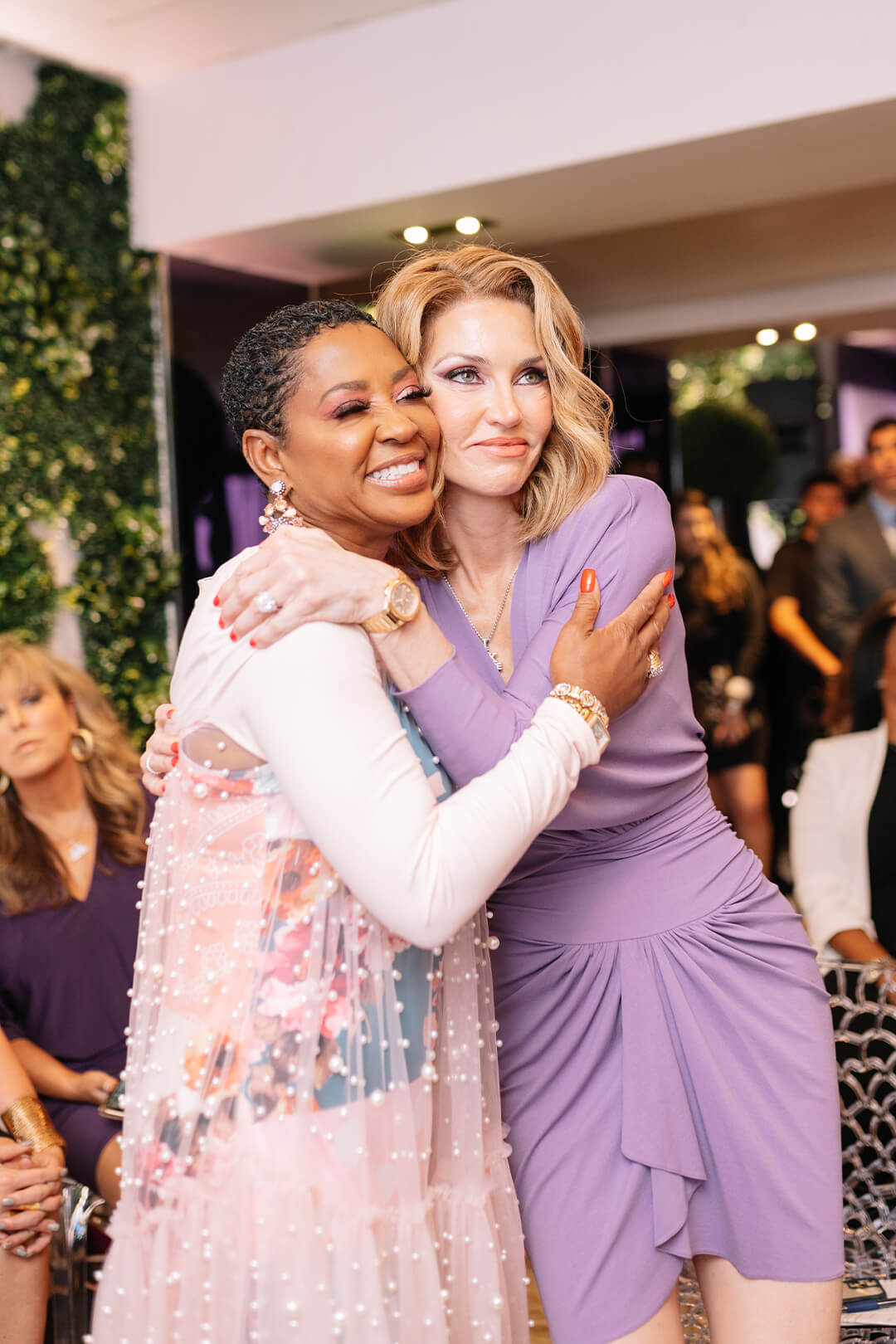 Gloria Mayfield Banks sharing a warm embrace with Elena Cardone at the 10X Ladies Conference