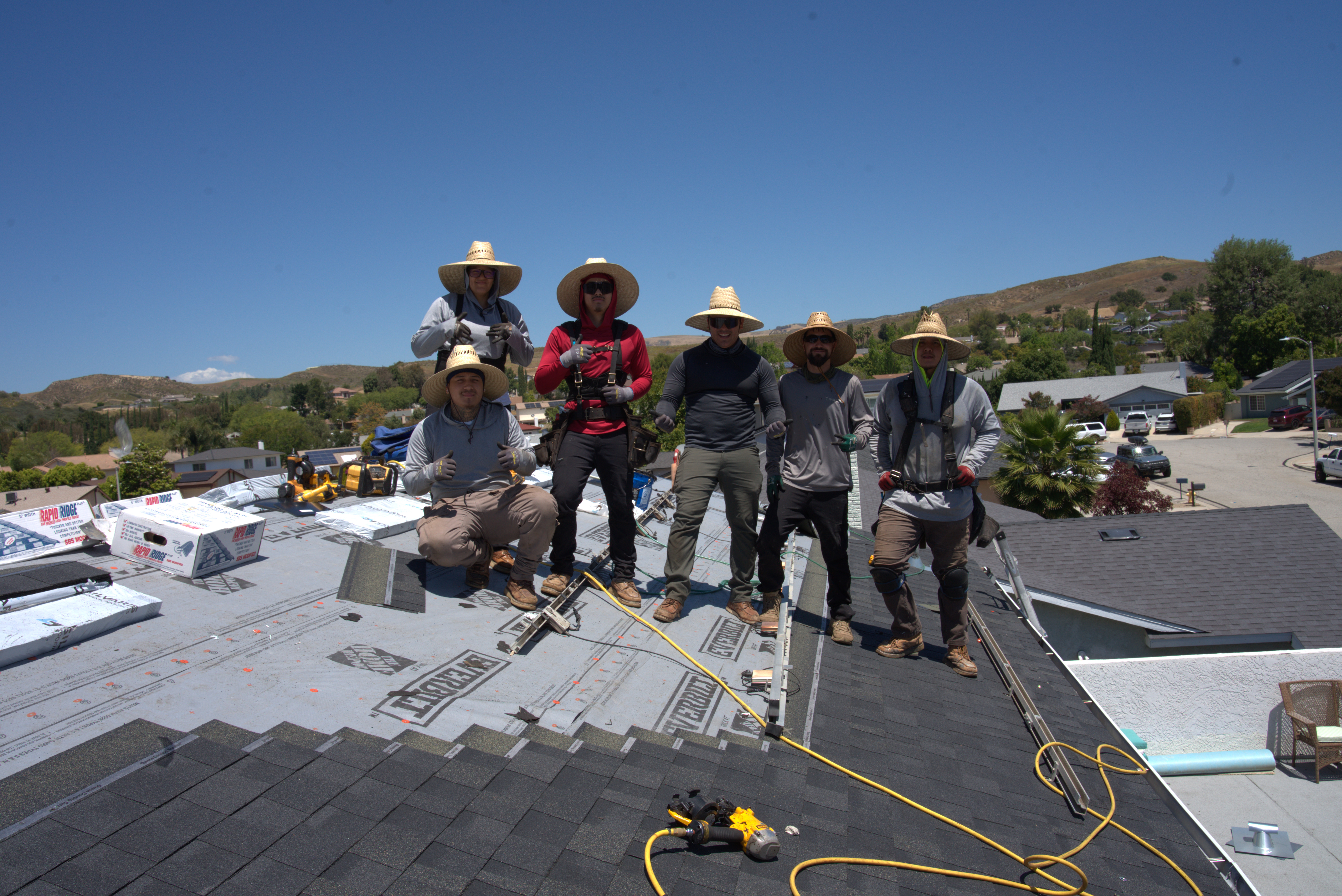 Sovereign Roofing crew on a completed roofing project