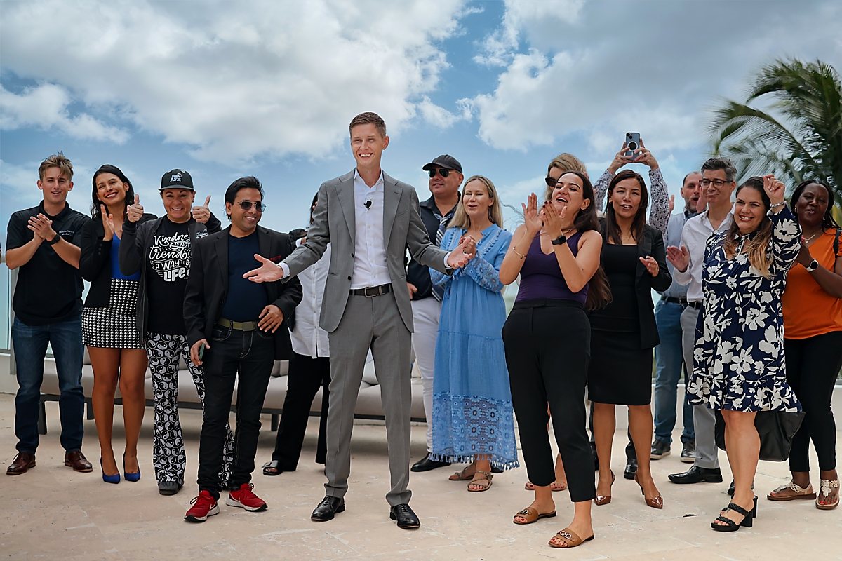 Cameron Smith with agents and guests outdoors in Southwest Florida