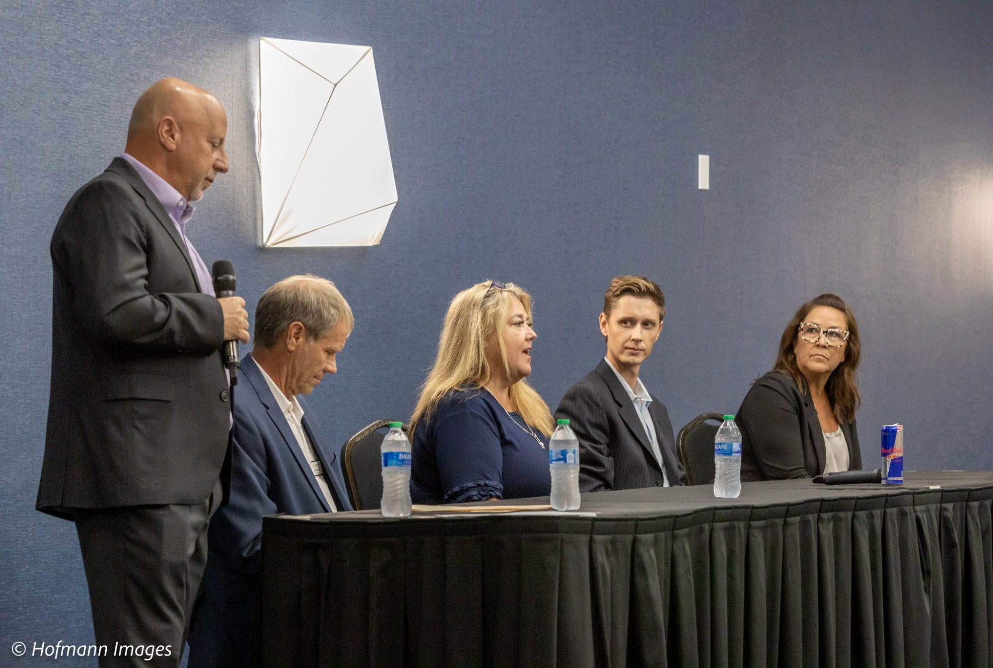 Cameron Smith speaking on a panel at an industry event