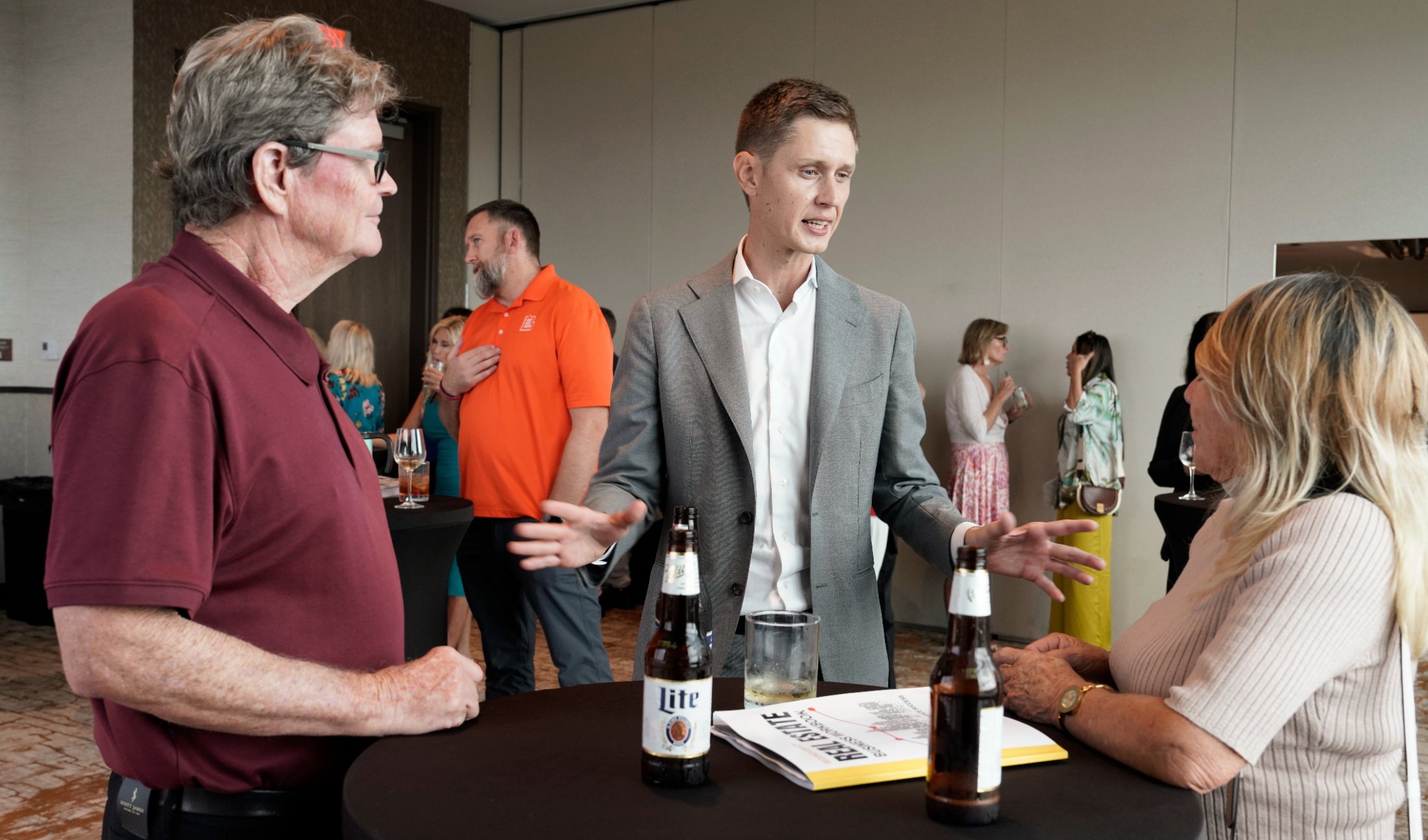Cameron Smith talking with agents at a NXTGEN event