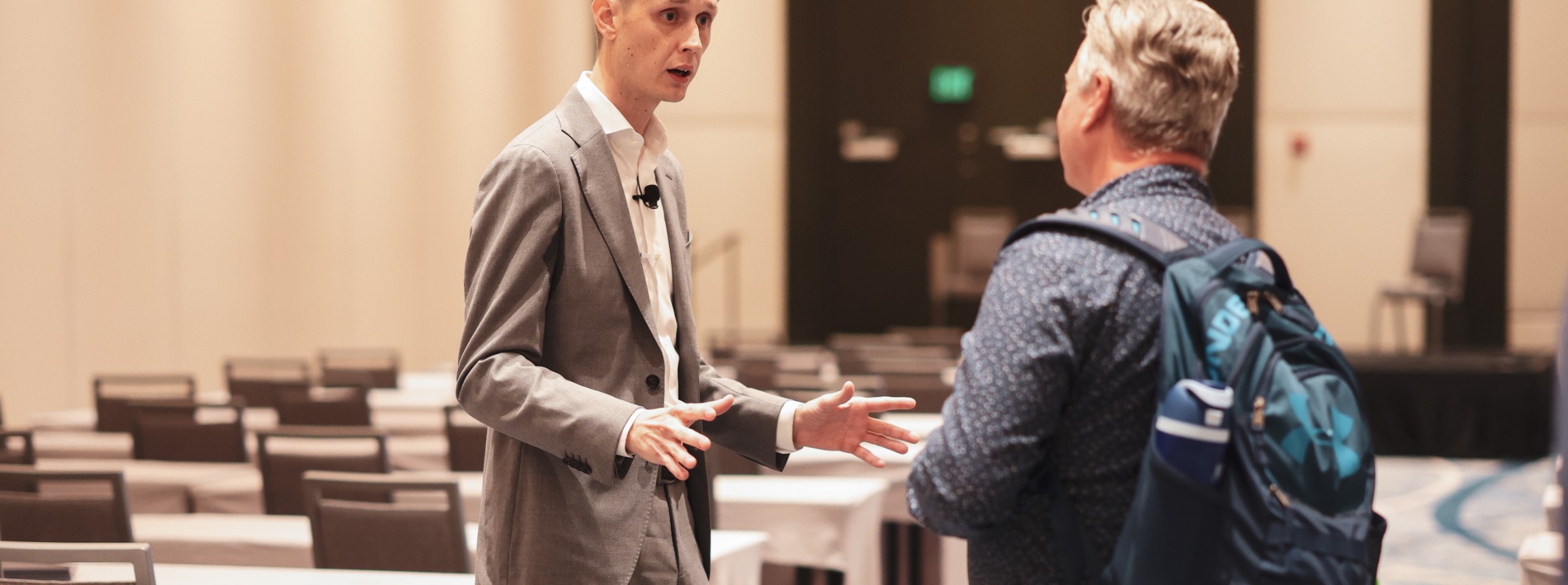 Cameron Smith talking one to one with an agent before an NXTGEN Agent session