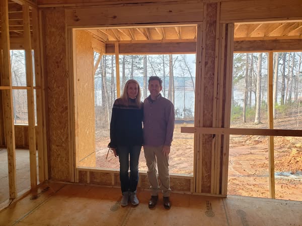 Zach and Kate at their lakehouse under construction