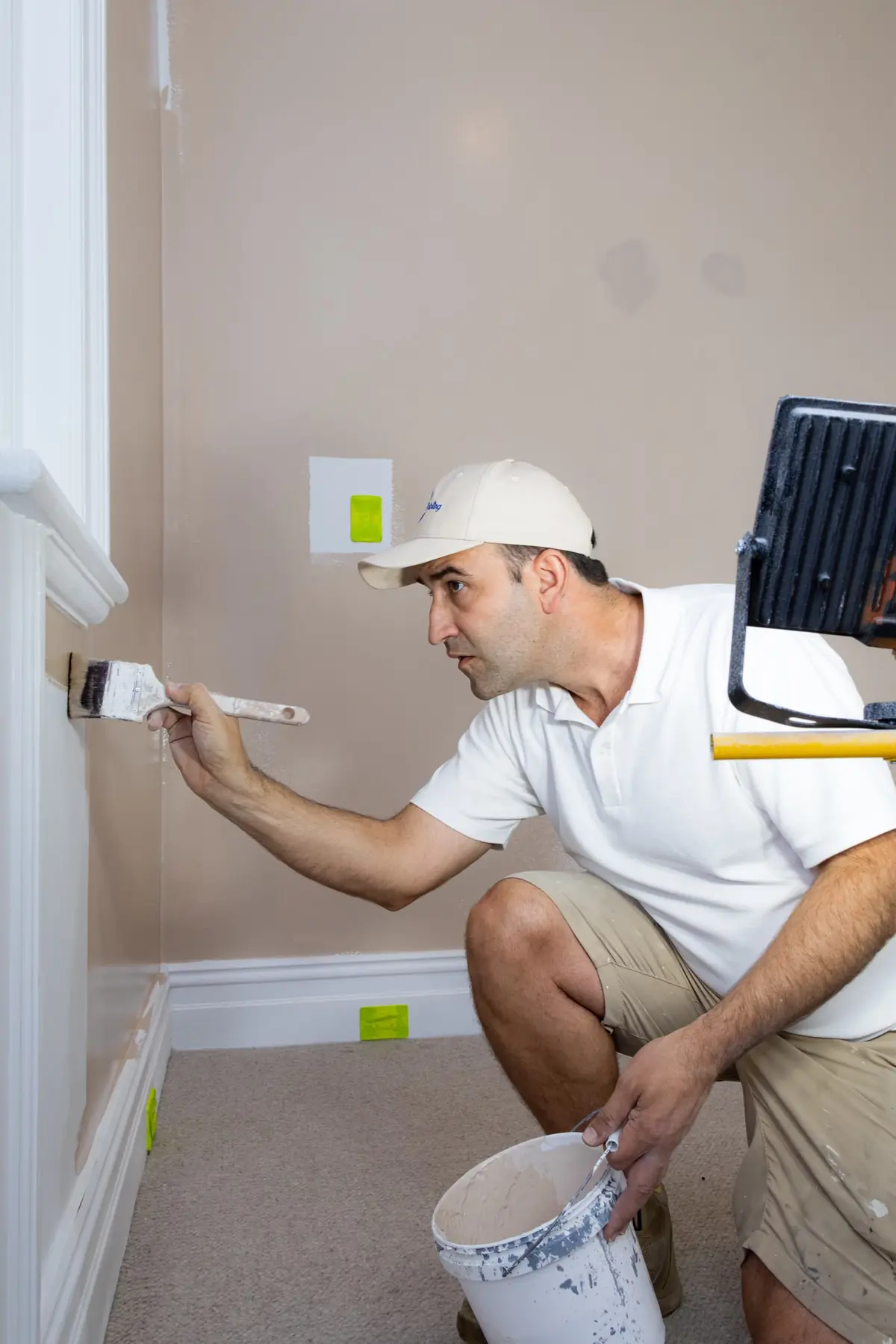 Spot Painting painter cutting in a wall edge with a brush