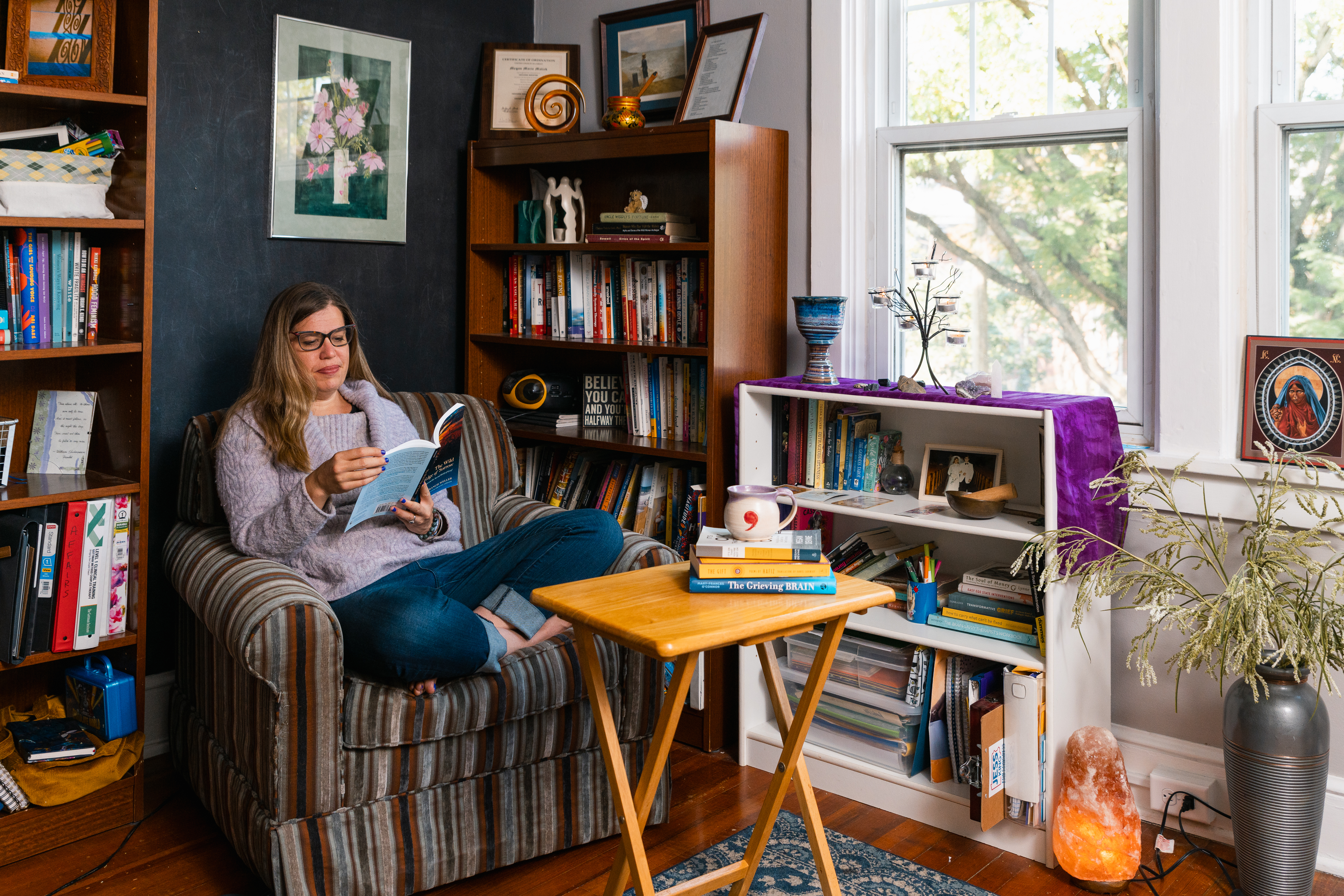 Image of Megan sitting on a bench and writing