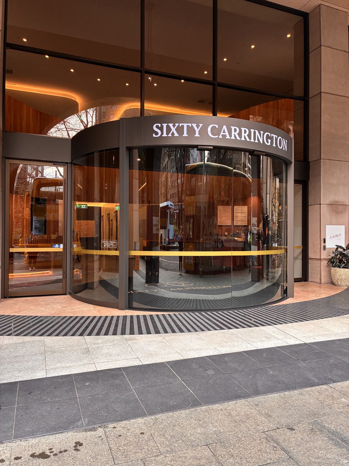 Curved glass automatic sliding entrance to a Sydney office tower lobby
