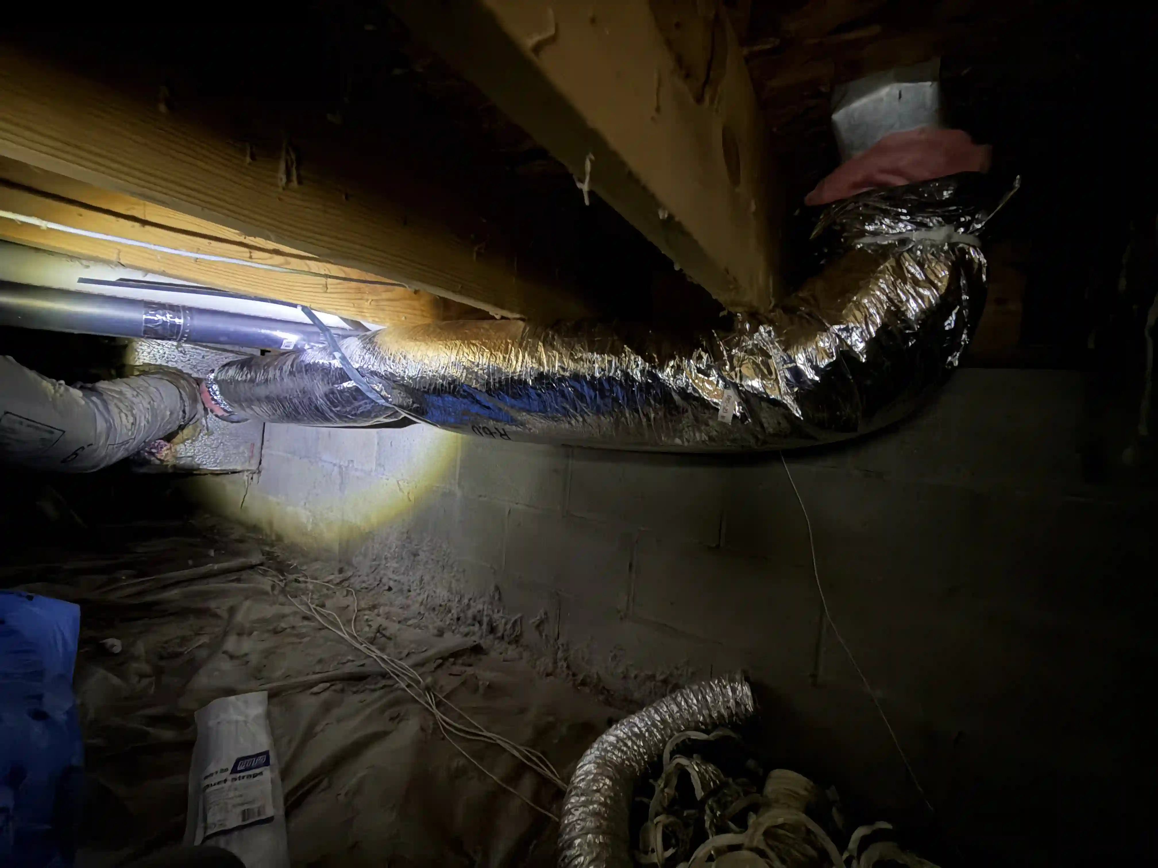 Residential HVAC ductwork in a crawlspace