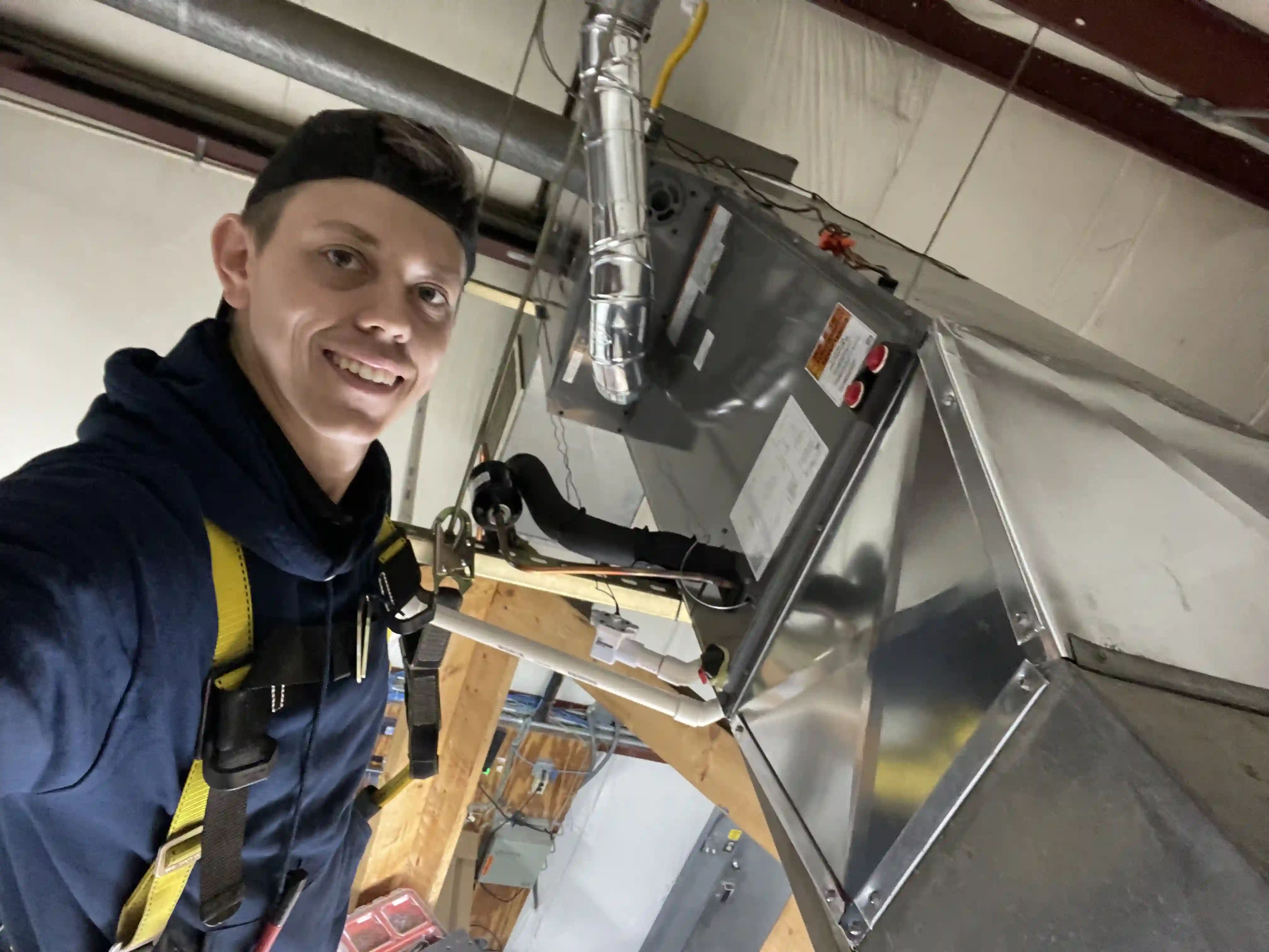 Gortech technician servicing a residential furnace and air conditioning system