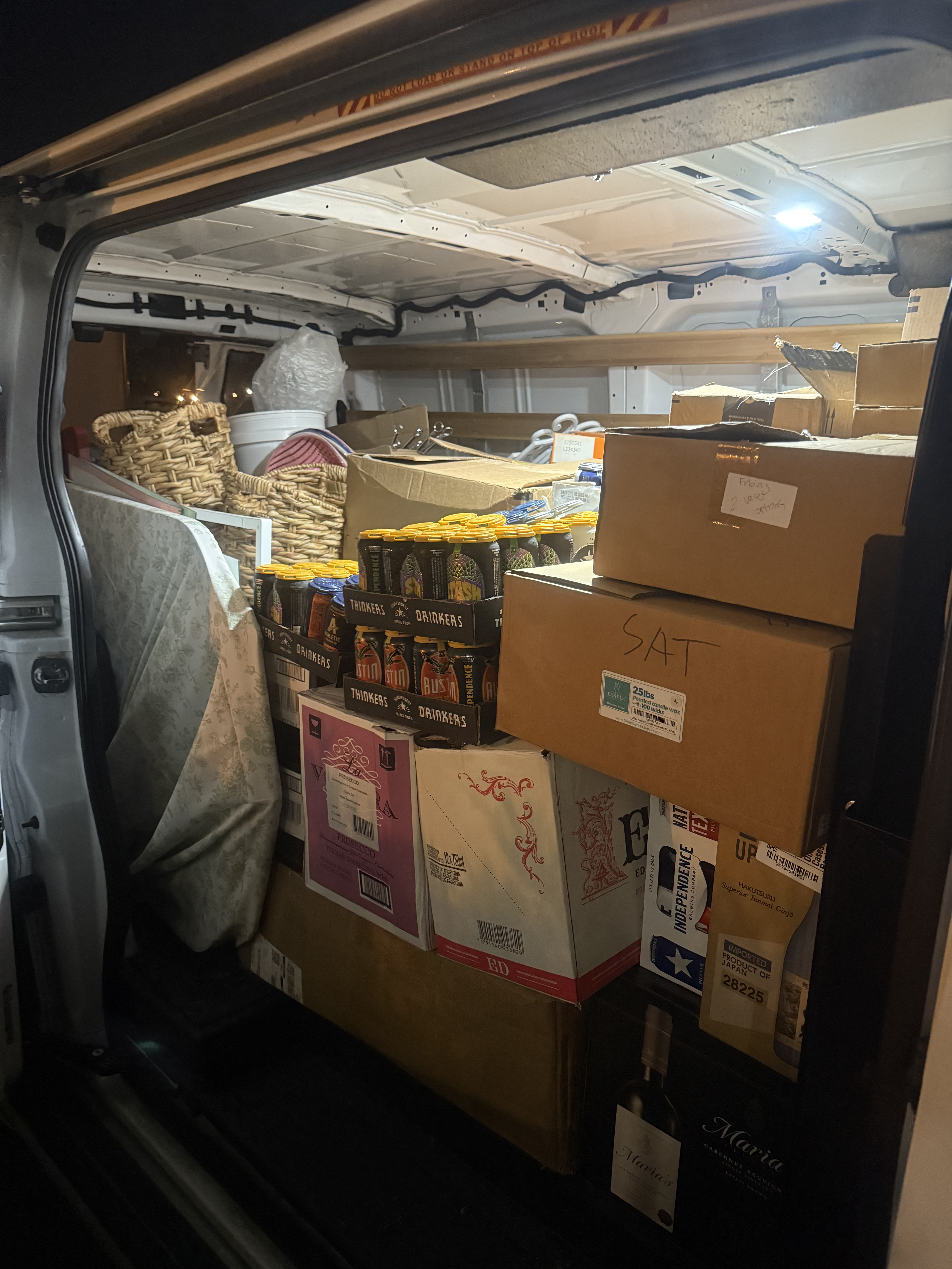 BTS team loading event supplies into vehicle for delivery
