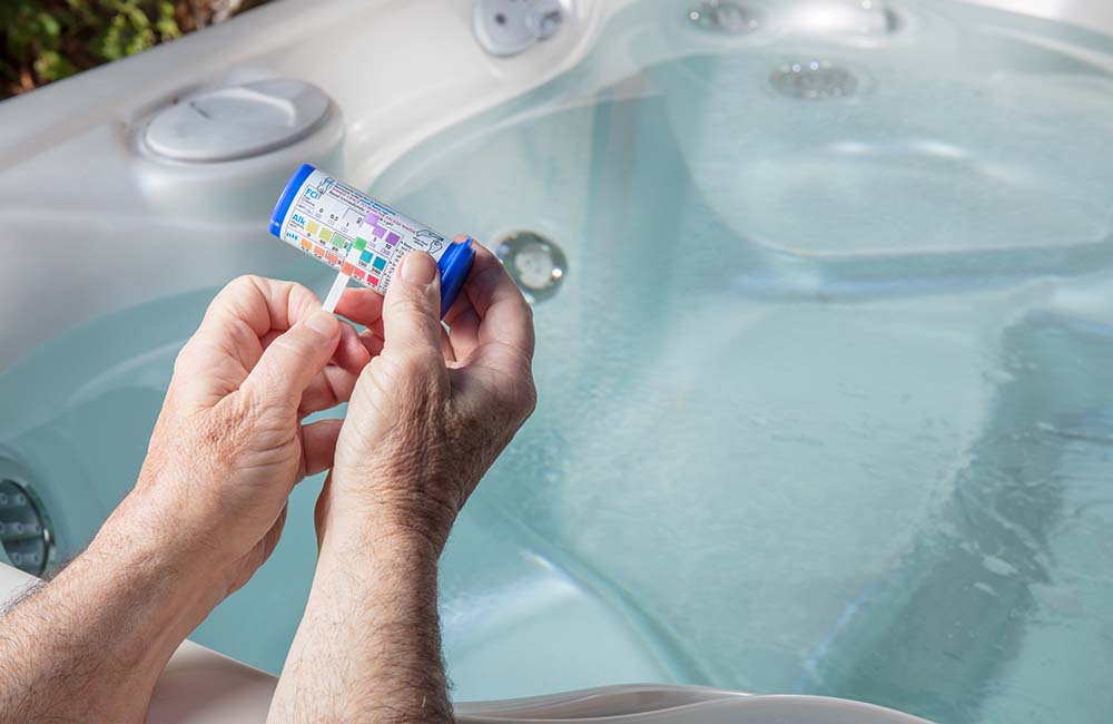Hot tub cleaning process including scrubbing, filter cleaning, and water testing