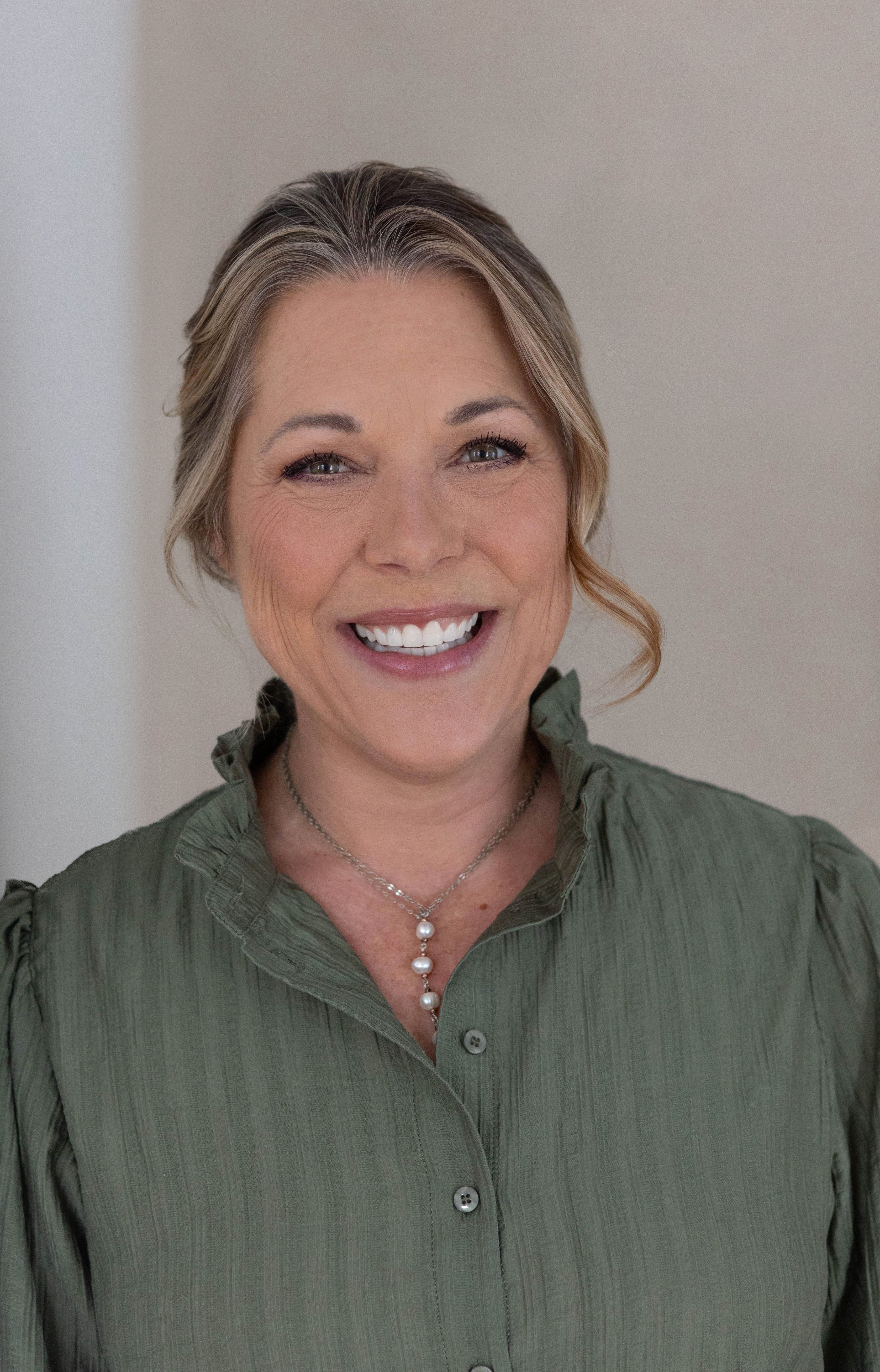 Pasha on stage smiling looking upward, discussing solution to teams struggling to sustain trusting and respectful relationships, and how that is essential for everyone at work to thrive.