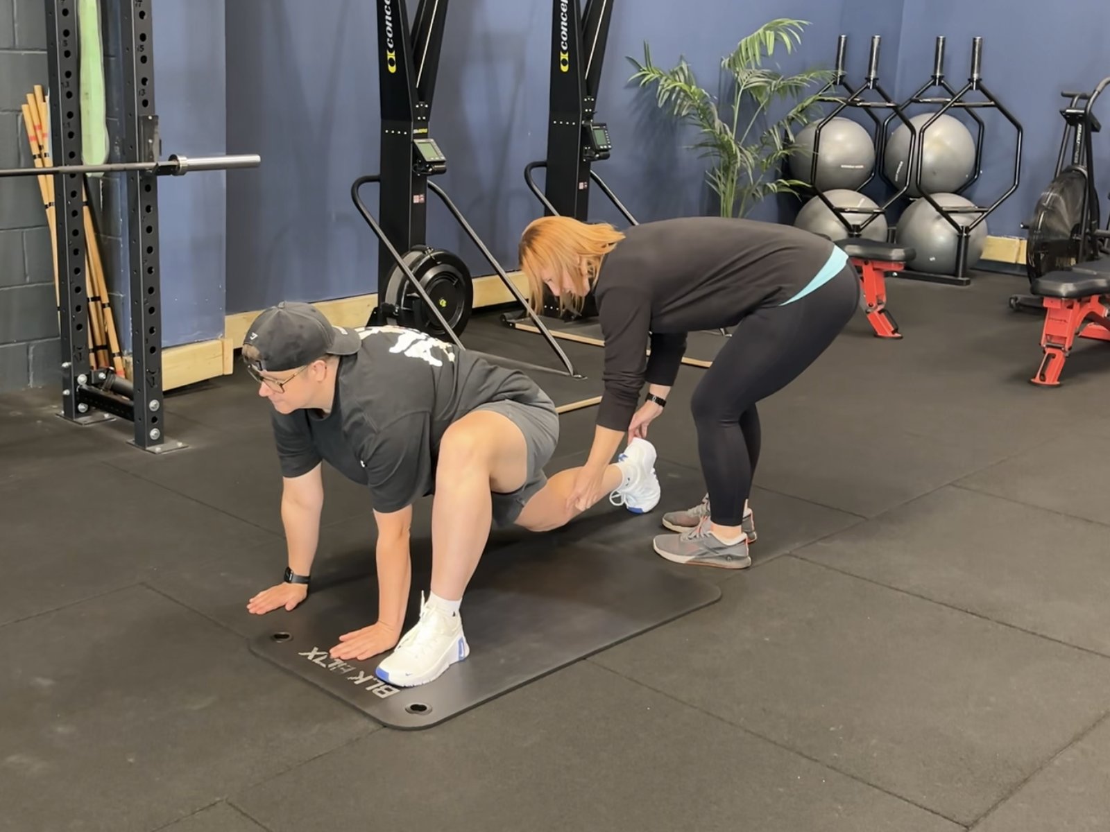 Infinity coach assessing a member's movement during a Health MOT
