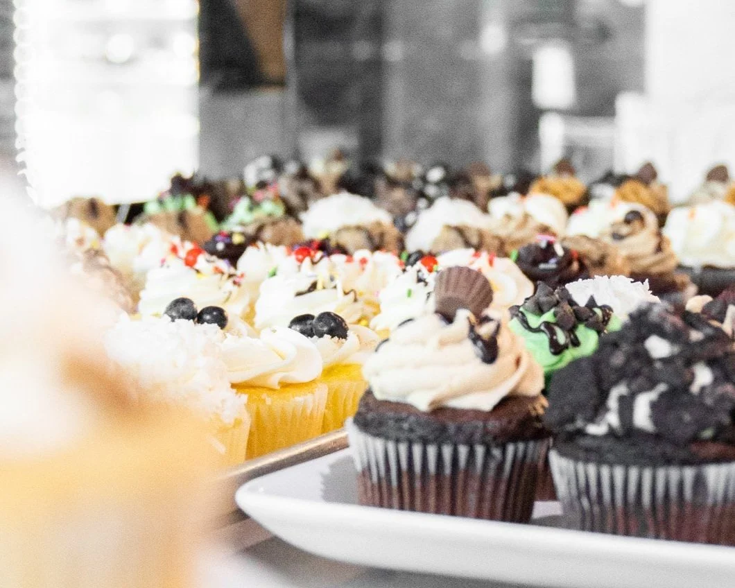 Assorted cupcakes in a bakery display