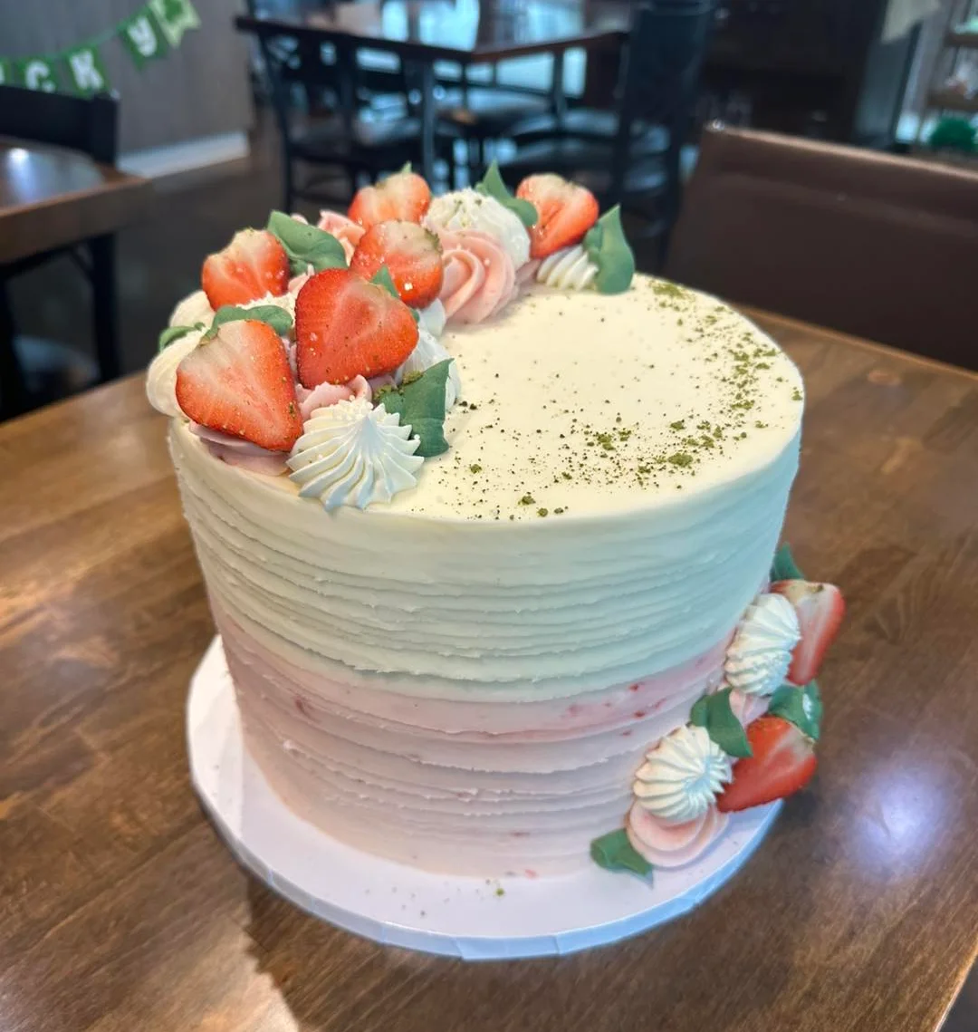 Layered strawberry cake with cream frosting