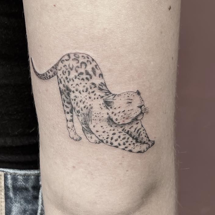 Horse with flowers tattoo on arm