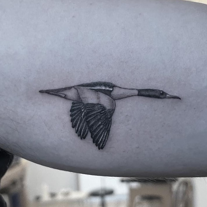 Smoking skeleton fine line tattoo on arm